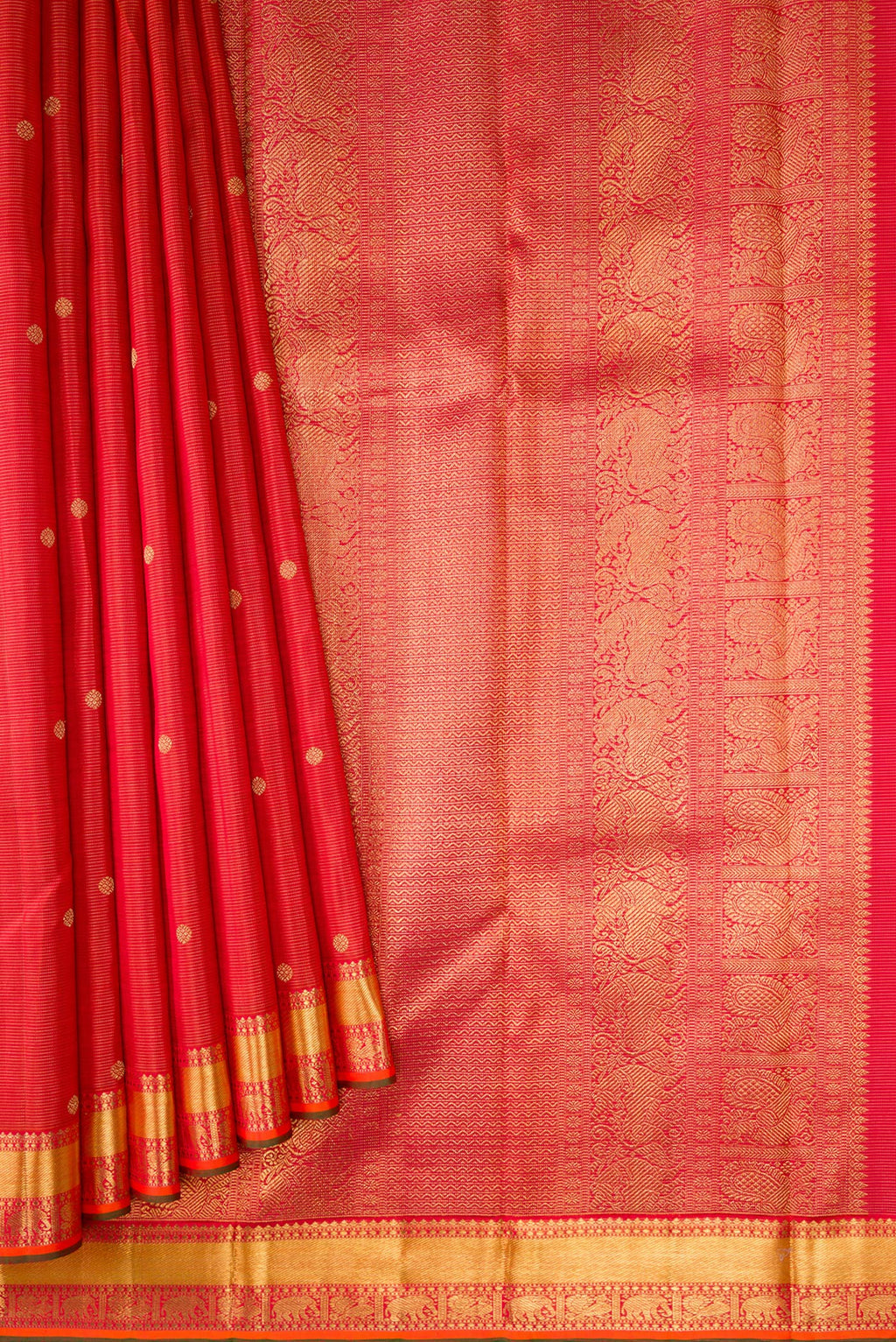 Pleats and pallu of Pure Silk Pure Zari Brick Orange Dual Tone Kanjivaram Saree with Stripes on the body and Zari Border. 