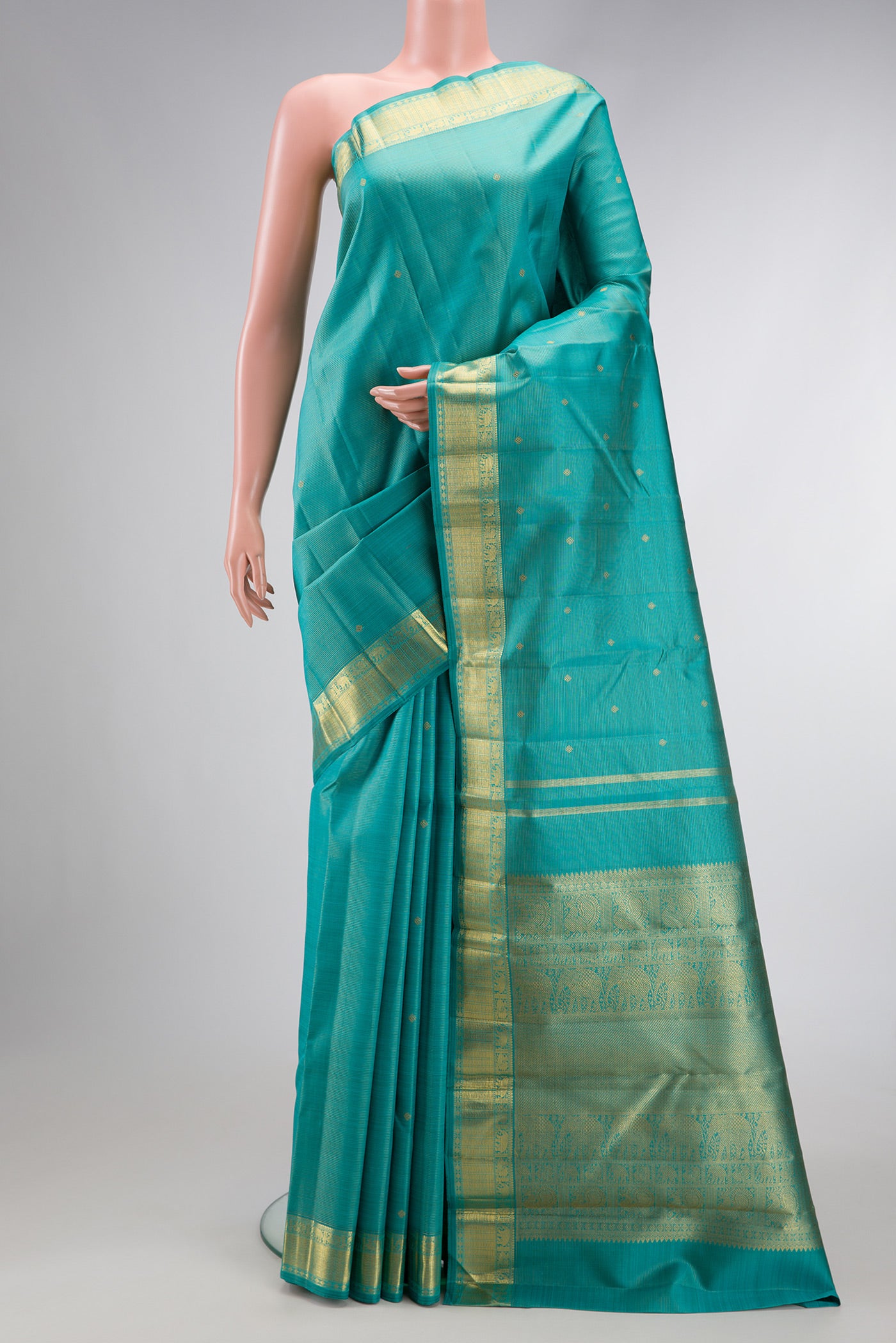 Pure Silk Pure Zari Light Blue Dual Tone Kanjivaram Saree with Stripes on the body and Zari Border.  displayed on a mannequin