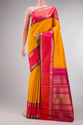 Pure Silk Pure Zari Mustard Kanjivaram Saree with Zari Butta on the body and Zari Border.  displayed on a mannequin