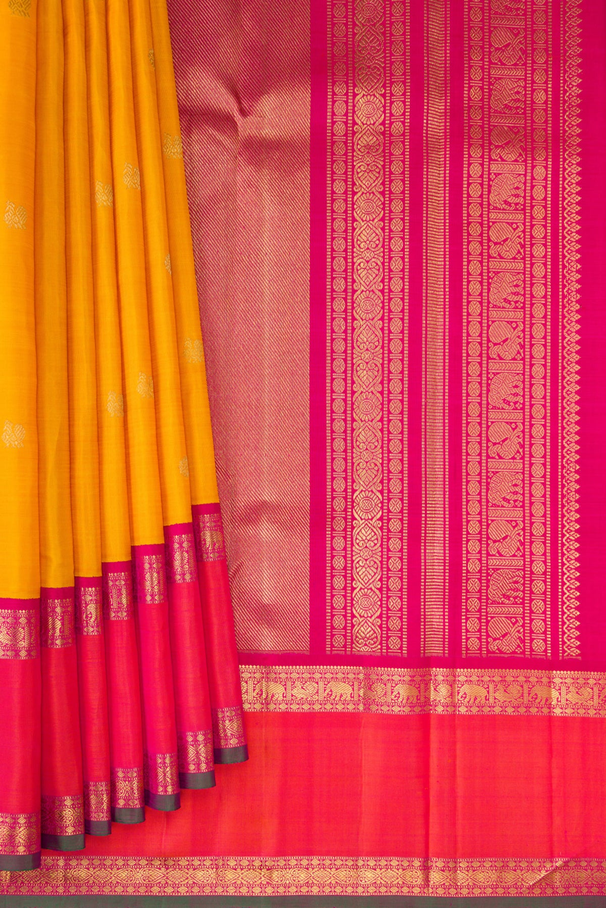 Pleats and pallu of Pure Silk Pure Zari Mustard Kanjivaram Saree with Zari Butta on the body and Zari Border. 
