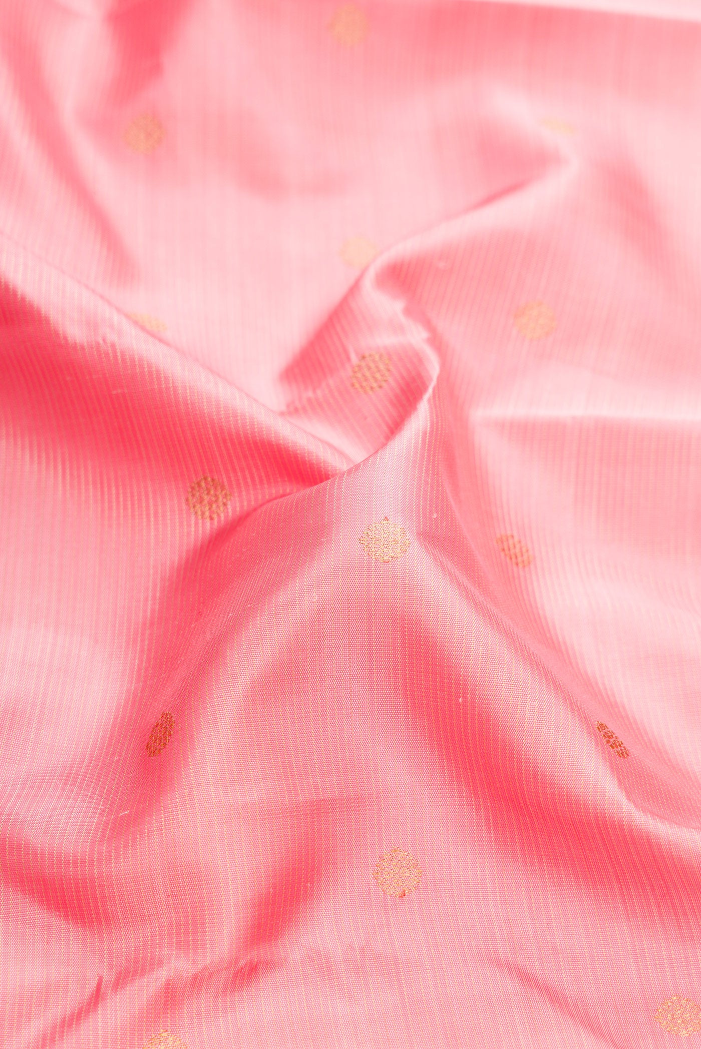 Close up of Pure Silk Pure Zari Pink Dual Tone Kanjivaram Saree with Stripes on the body and Zari Border.  displaying folds