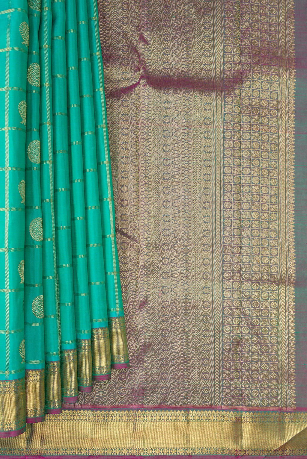 Pleats and pallu of Pure Silk Pure Zari Sea Green Kanjivaram Saree with Checked design on the body and Zari Border. 