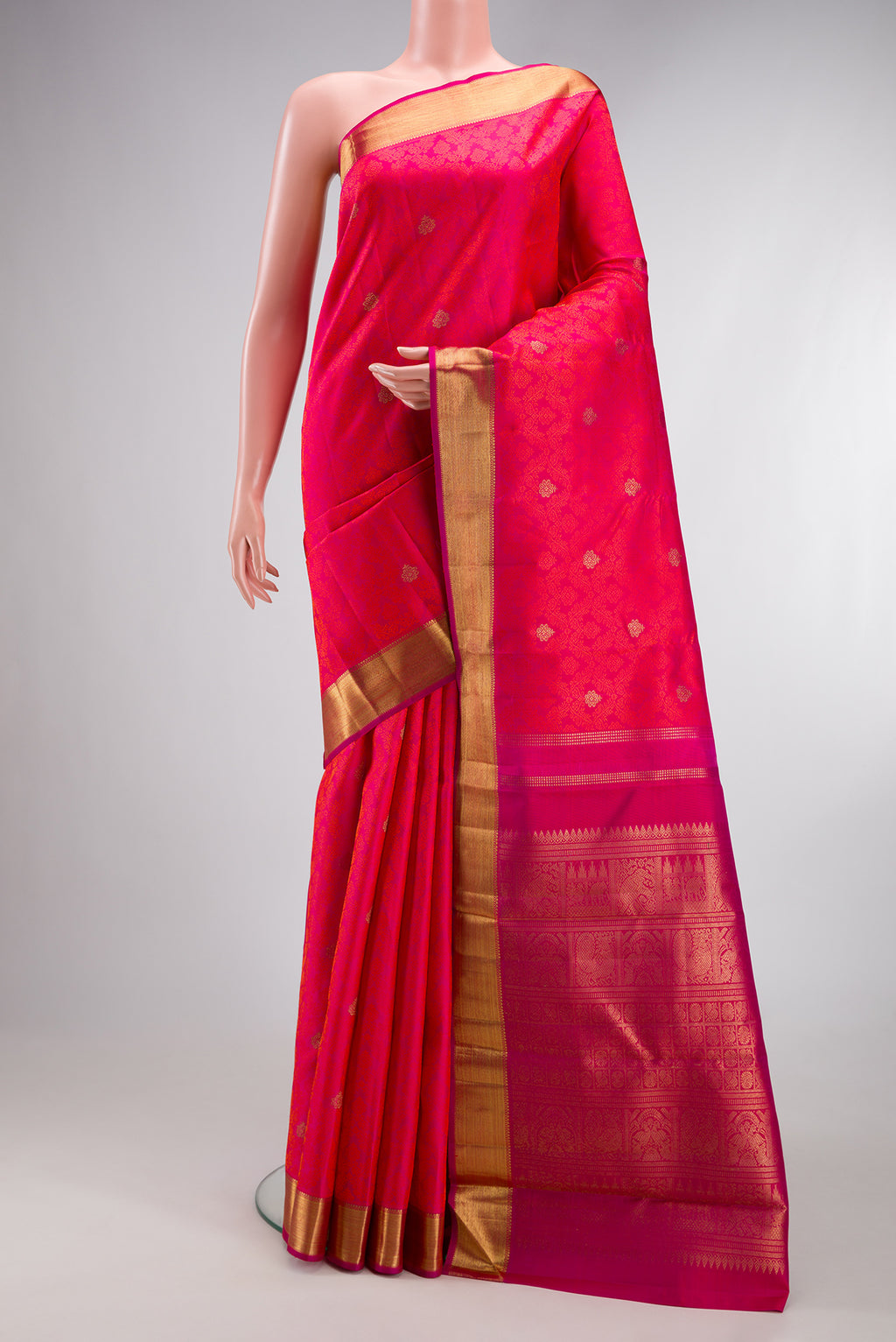 Pure Silk Pure Zari Pink Dual Tone Kanjivaram Saree with Jacquard With Zari Butta on the body and Zari Border.  displayed on a mannequin