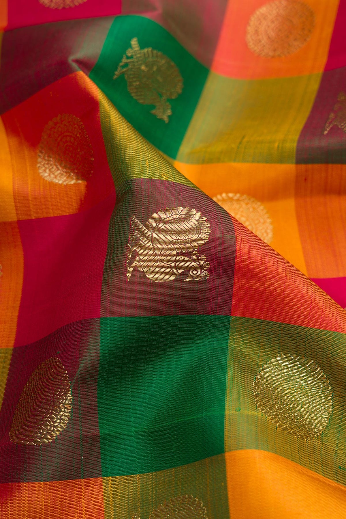 Close up of Pure Silk Pure Zari Multi Color Kanjivaram Saree with Checked design on the body and Zari Border.  displaying folds