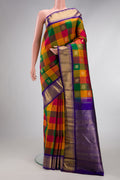 Pure Silk Pure Zari Multi Color Kanjivaram Saree with Checked design on the body and Zari Border.  displayed on a mannequin
