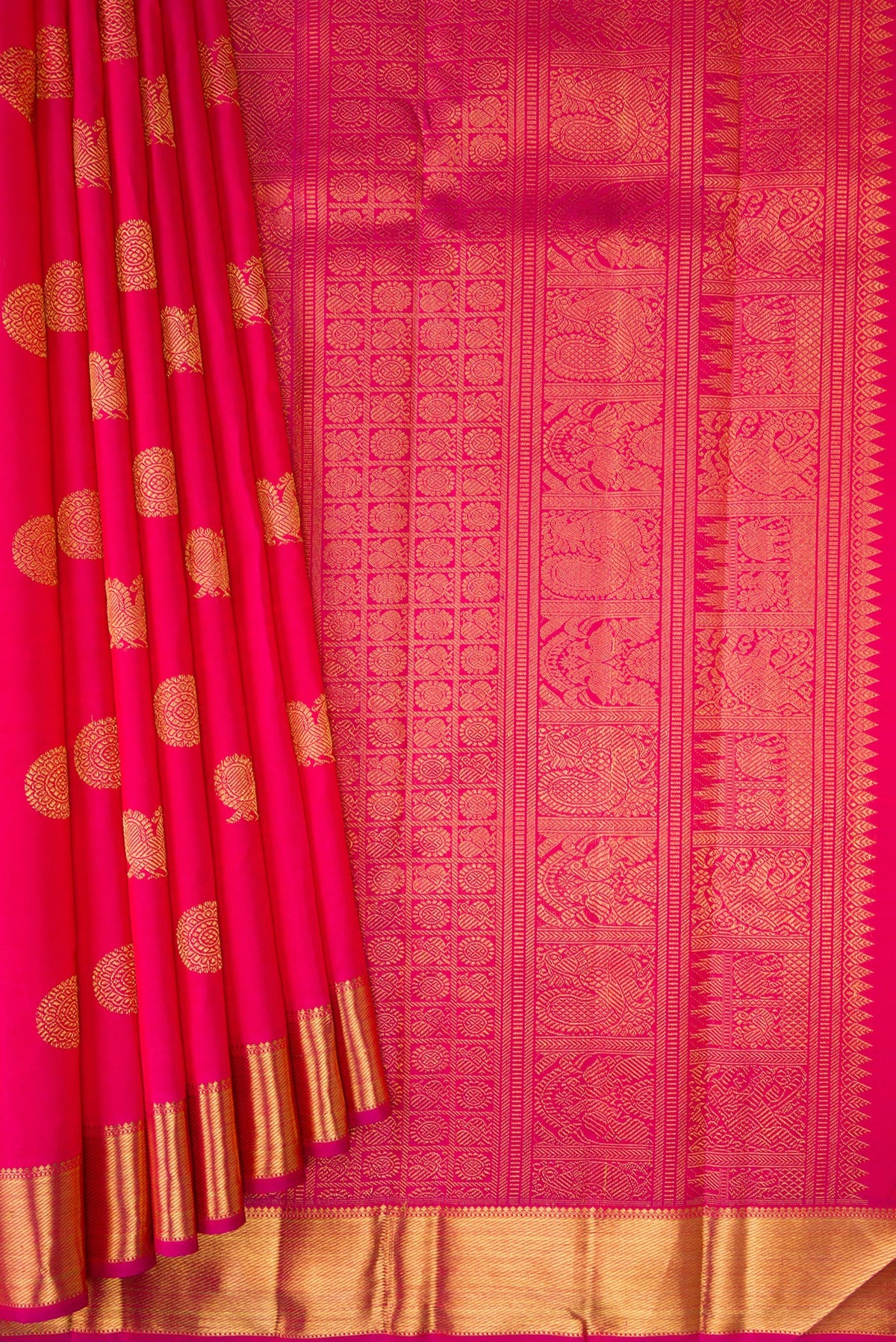 Pleats and pallu of Pure Silk Pure Zari Pink Kanchipuram Saree with Zari Butta on the body and Zari Border. 