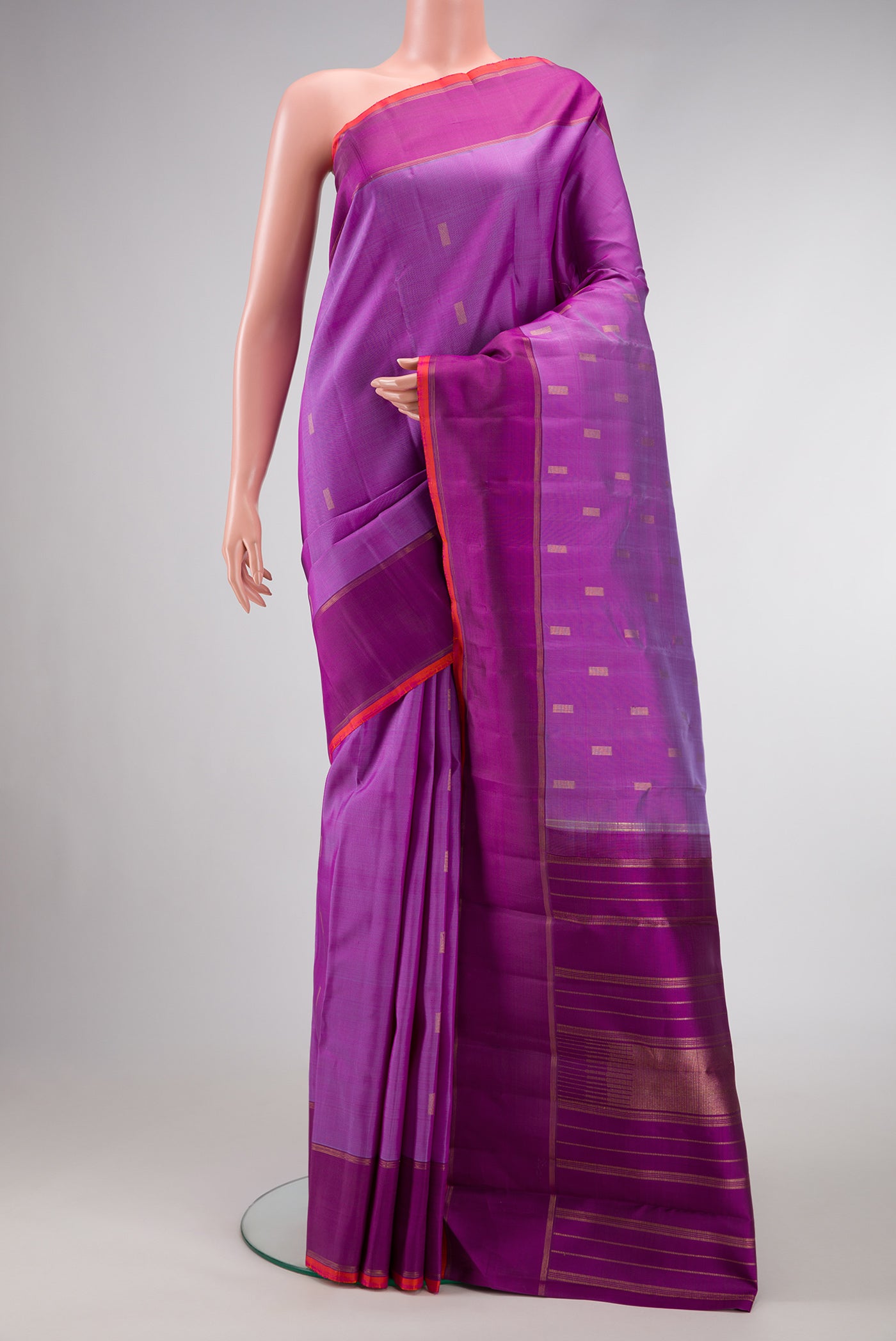 Pure Silk Pure Zari Purple Dual Tone Kanjivaram Saree with Zari Butta on the body and Zari Border.  displayed on a mannequin