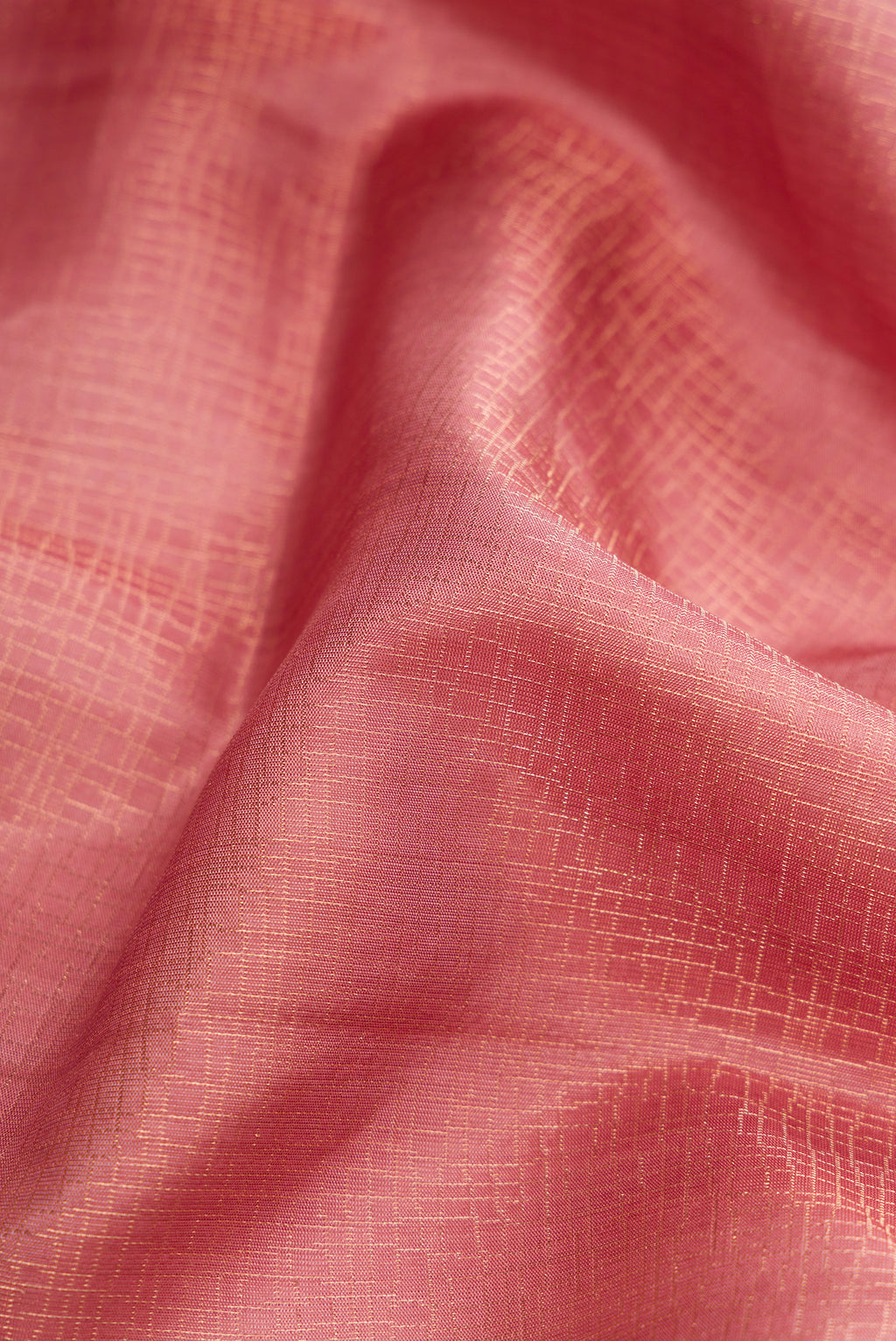Close up of Rose Gold Dual Tone Soft Silk Saree with Zari Brocade on the body and Zari Border.  displaying folds