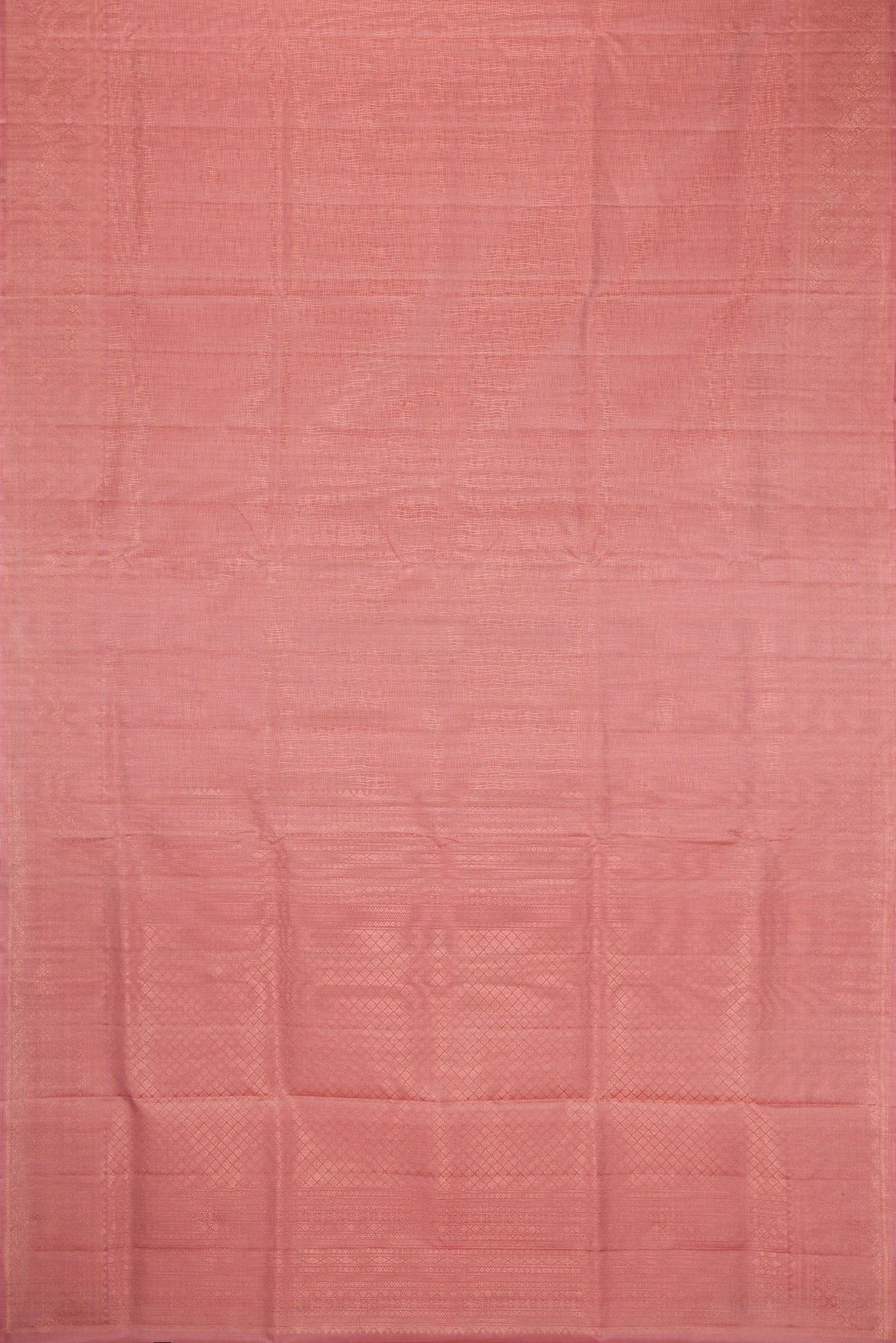 Flat view of Rose Gold Dual Tone Soft Silk Saree with Zari Brocade on the body and Zari Border. 