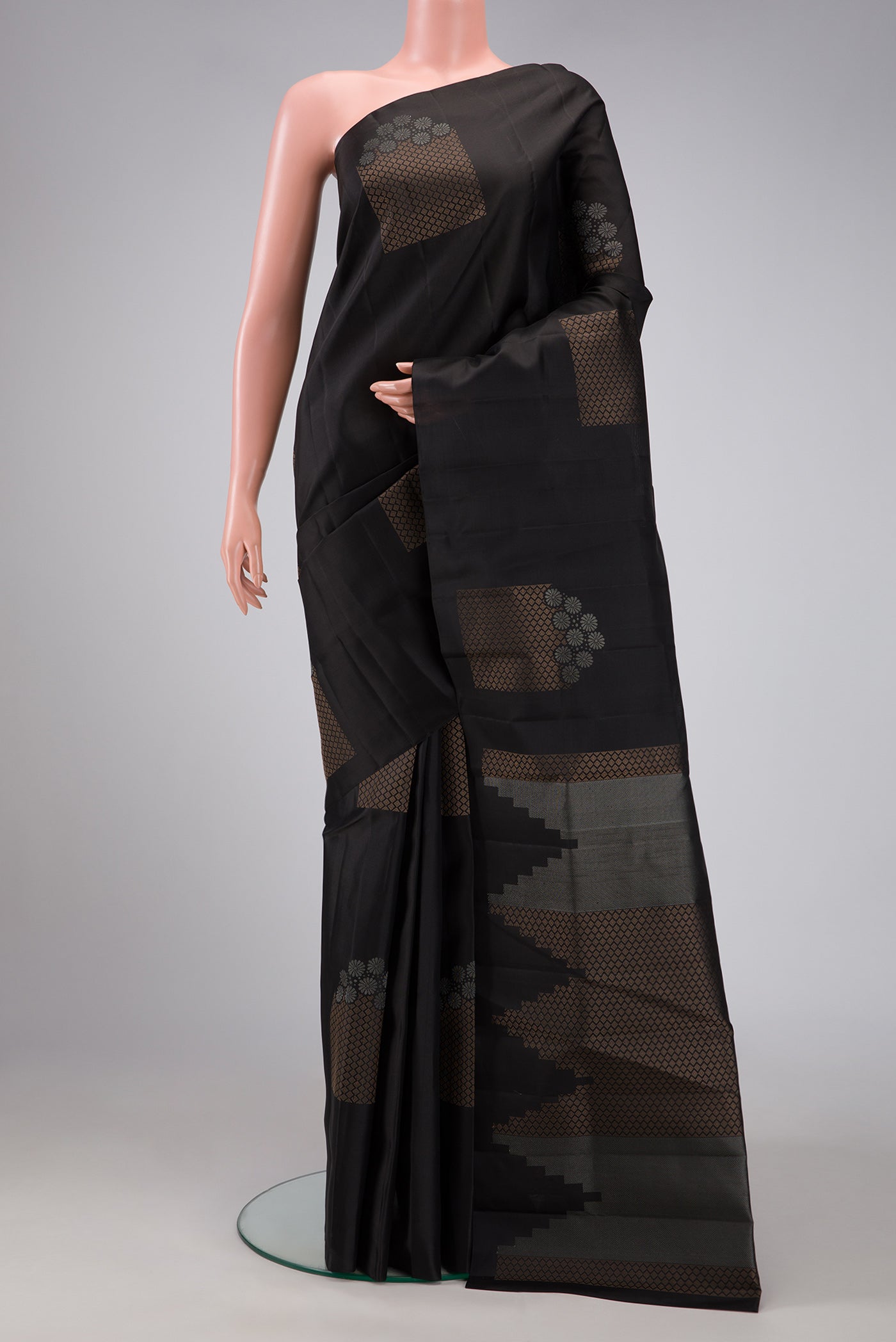 Black Dual Tone Soft Silk Saree with Zari Butta on the body and Without Border.  displayed on a mannequin