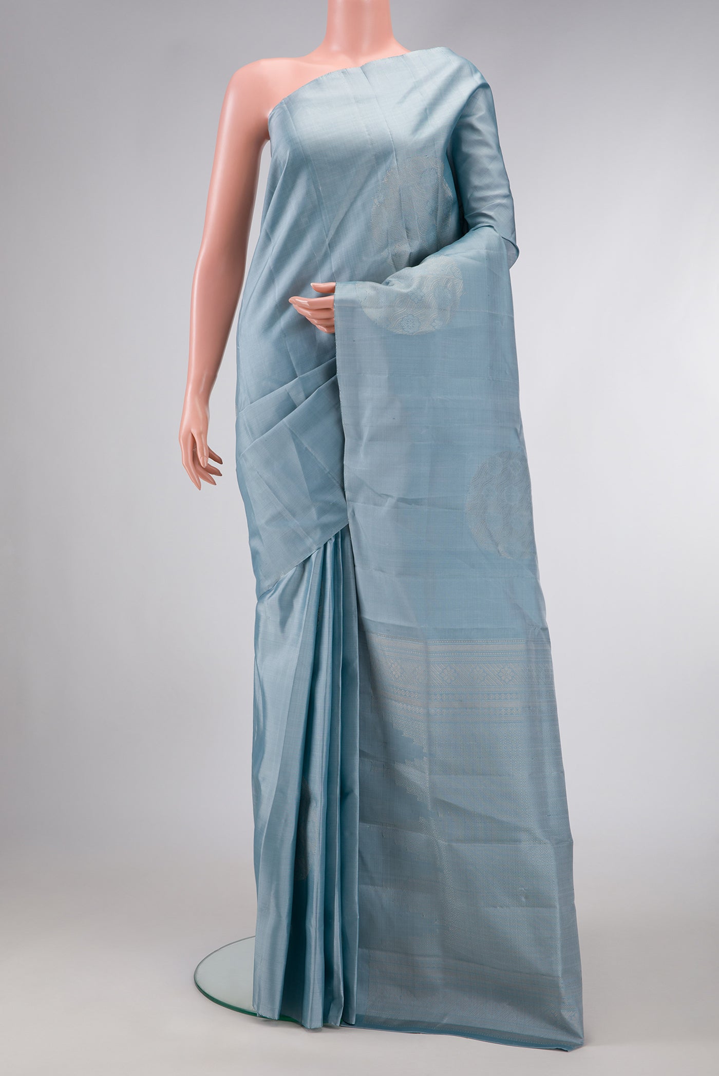 Grey Dual Tone Soft Silk Saree with Zari Butta on the body and Without Border.  displayed on a mannequin