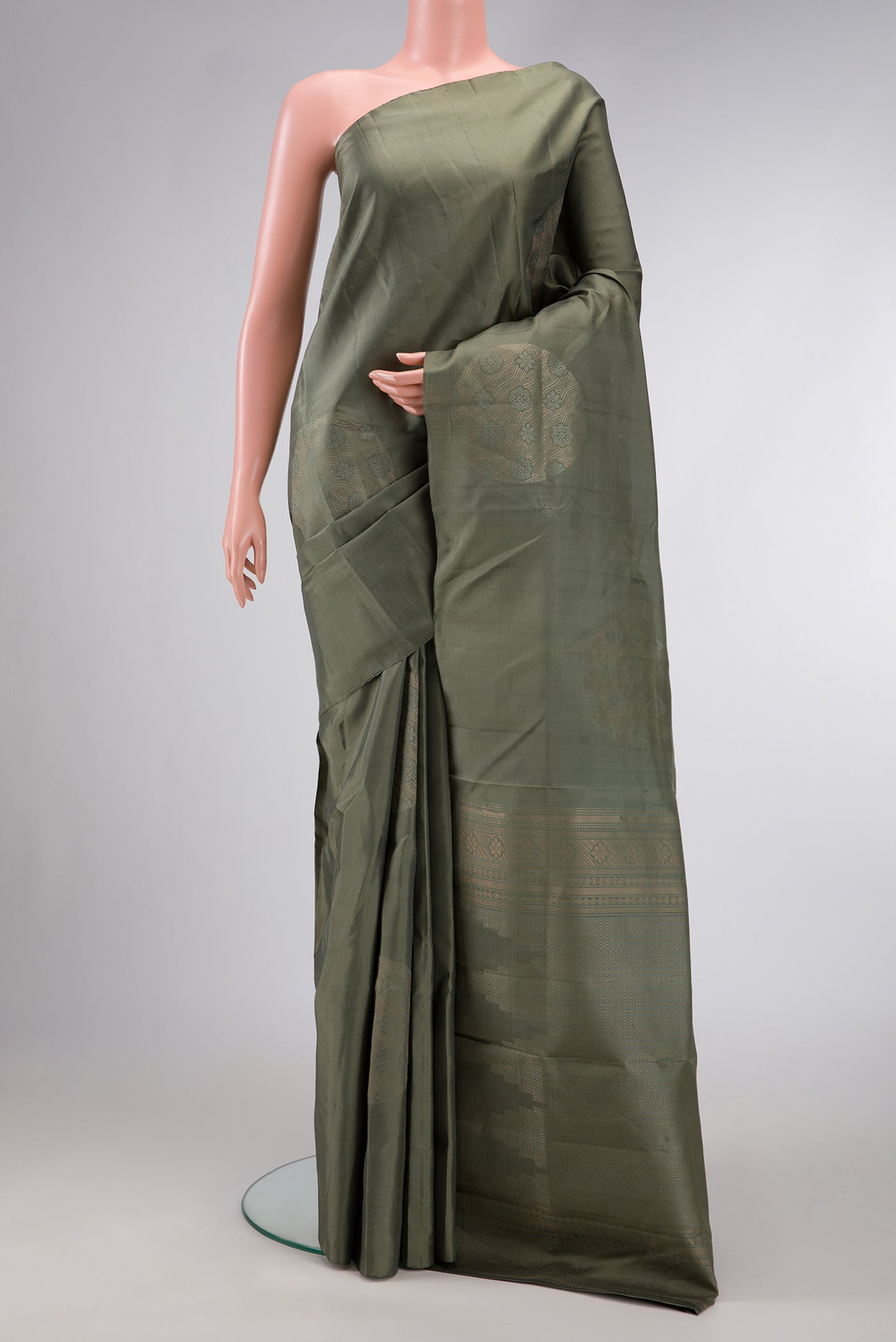 Brown Dual Tone Soft Silk Saree with Zari Butta on the body and Without Border.  displayed on a mannequin