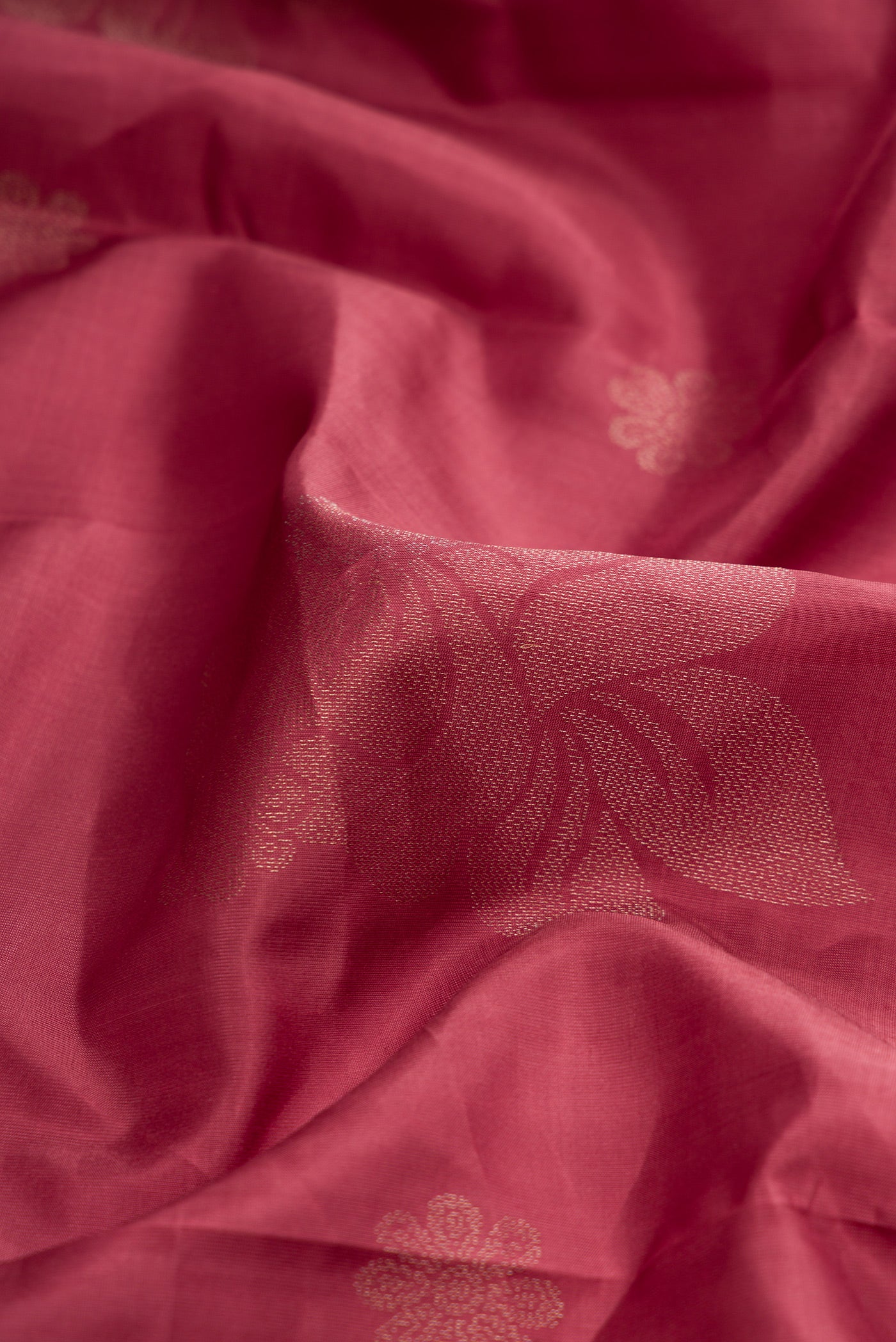 Close up of Mauve Dual Tone Soft Silk Saree with Zari Butta on the body and Without Border.  displaying folds
