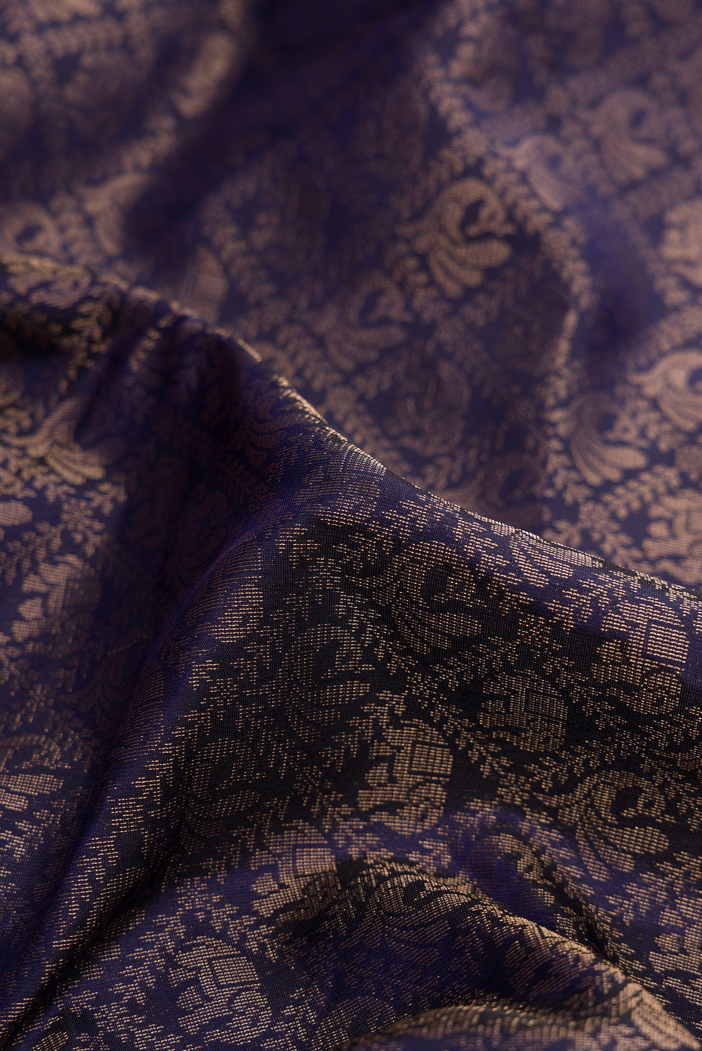 Close up of Navy Blue Dual Tone Soft Silk Saree with Zari Brocade on the body and Fancy Border.  displaying folds
