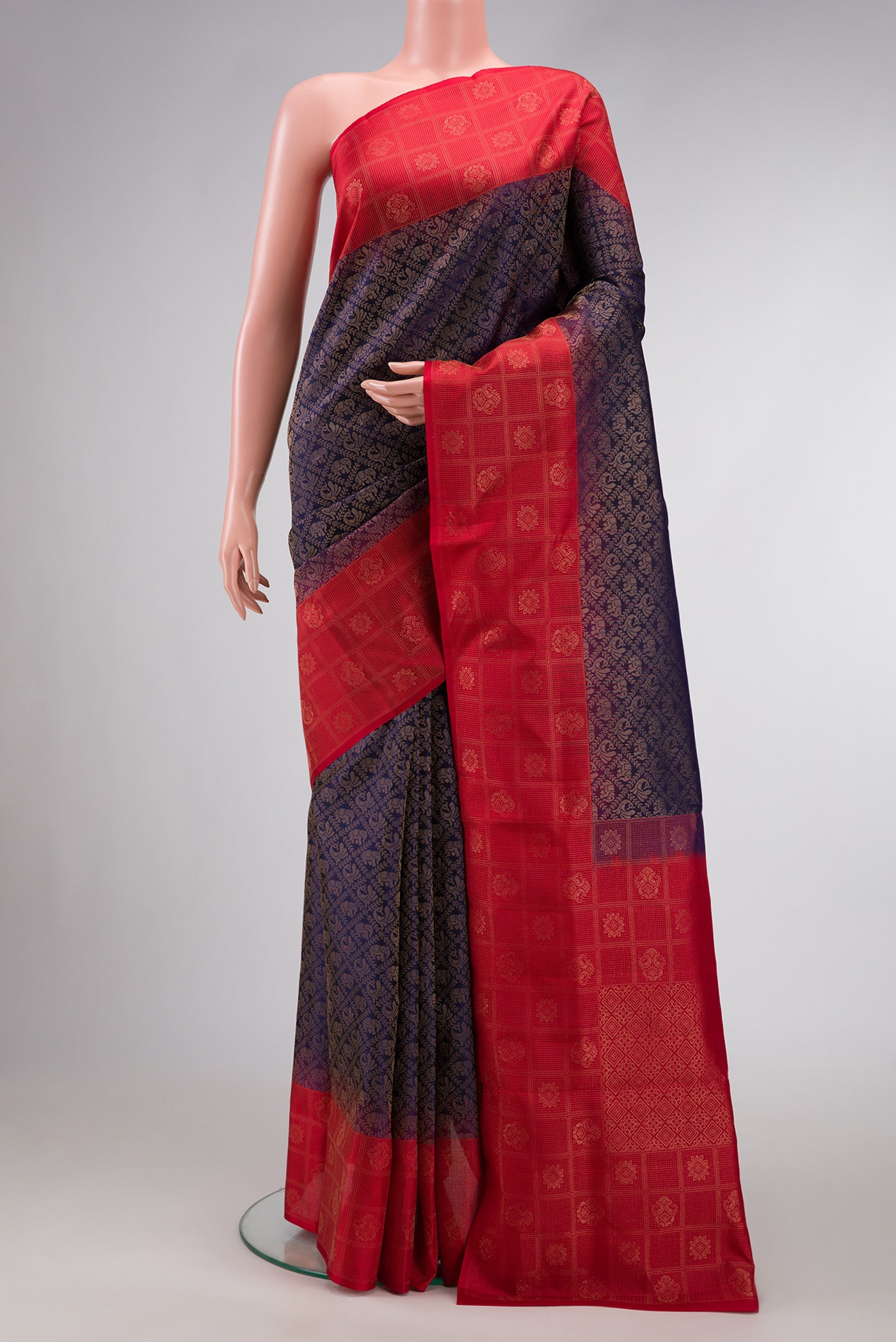 Navy Blue Dual Tone Soft Silk Saree with Zari Brocade on the body and Fancy Border.  displayed on a mannequin