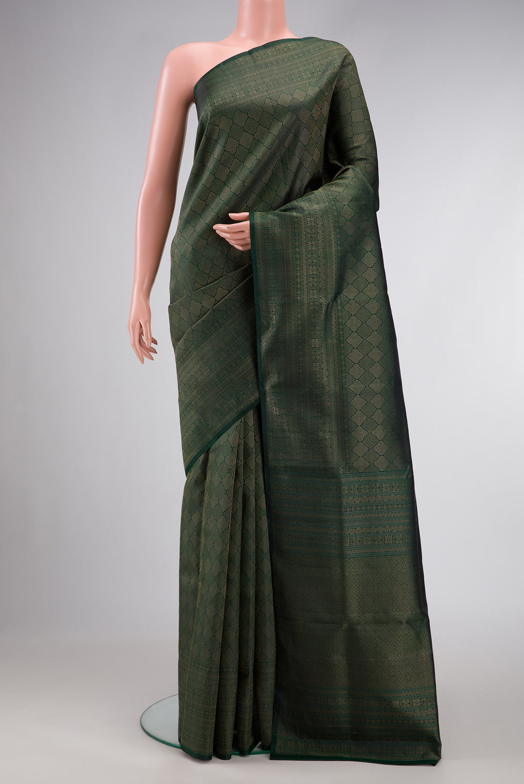 Bottle Green Dual Tone Soft Silk Saree with Zari Brocade on the body and Fancy Border.  displayed on a mannequin