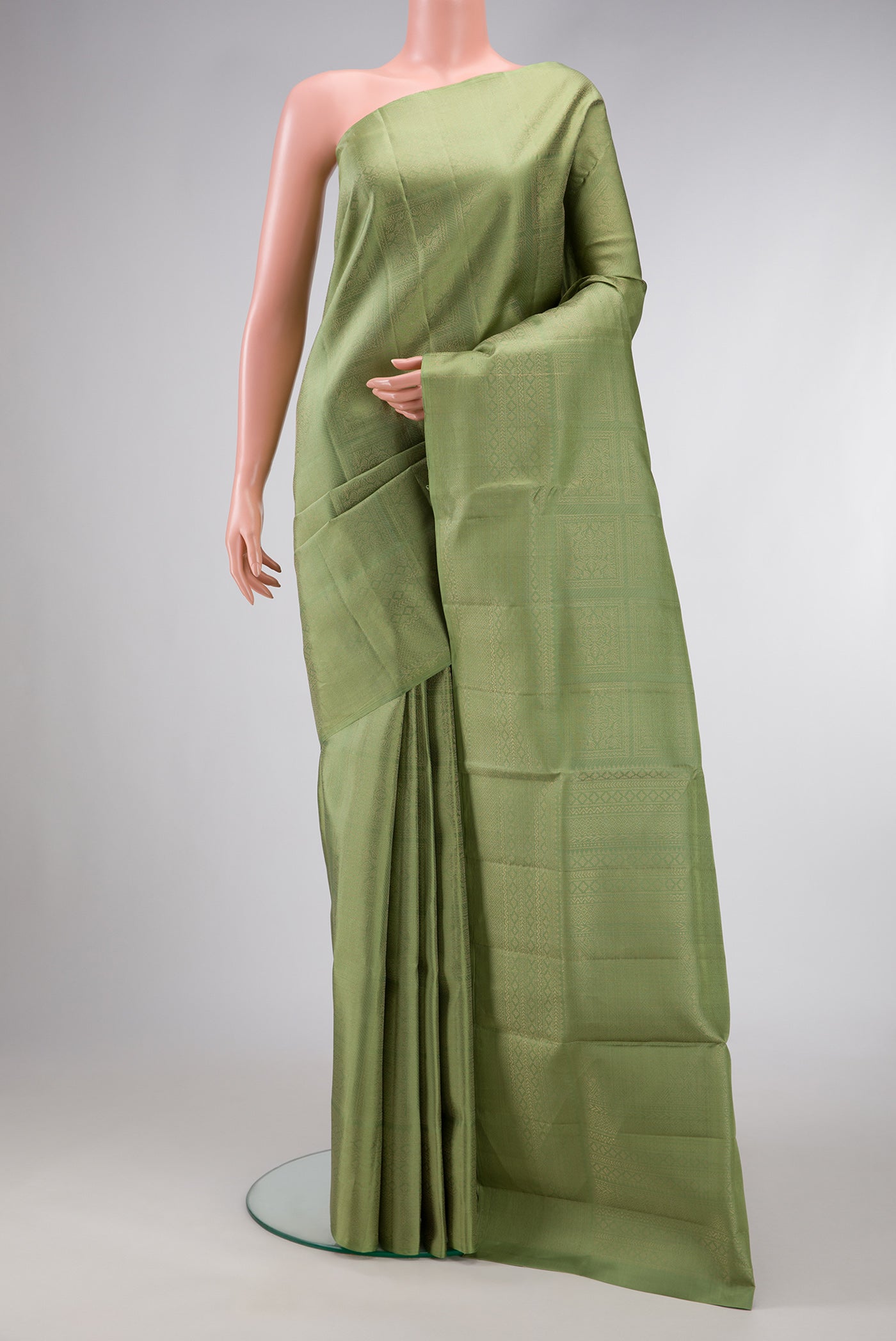 Green Dual Tone Soft Silk Saree with Zari Brocade on the body and Zari Border.  displayed on a mannequin