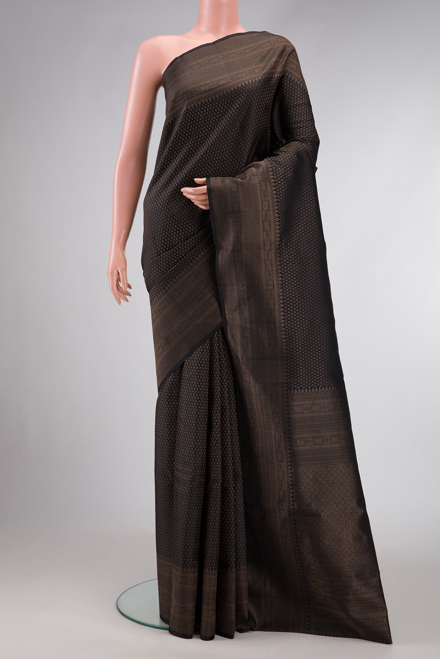 Black Dual Tone Soft Silk Saree with Zari Brocade on the body and Fancy Border.  displayed on a mannequin