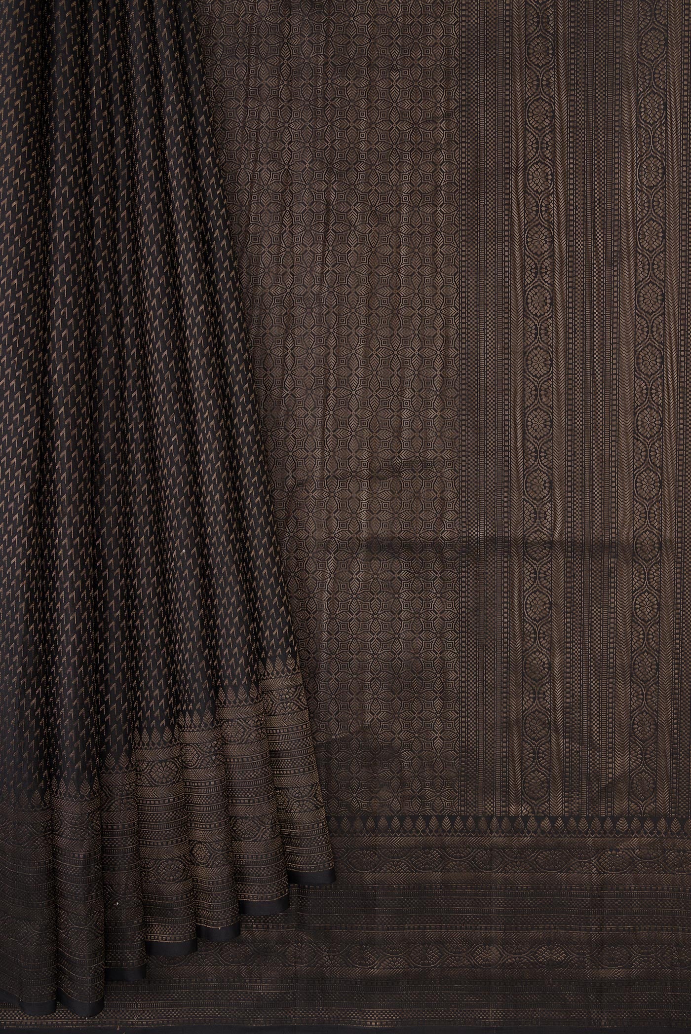 Pleats and pallu of Black Dual Tone Soft Silk Saree with Zari Brocade on the body and Fancy Border. 