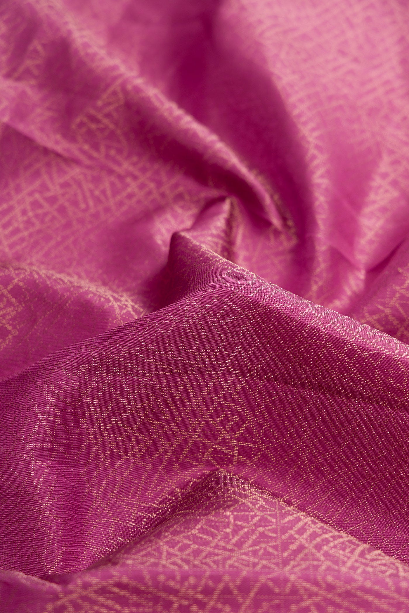 Close up of Purple Dual Tone Soft Silk Saree with Zari Brocade on the body and Zari Border.  displaying folds
