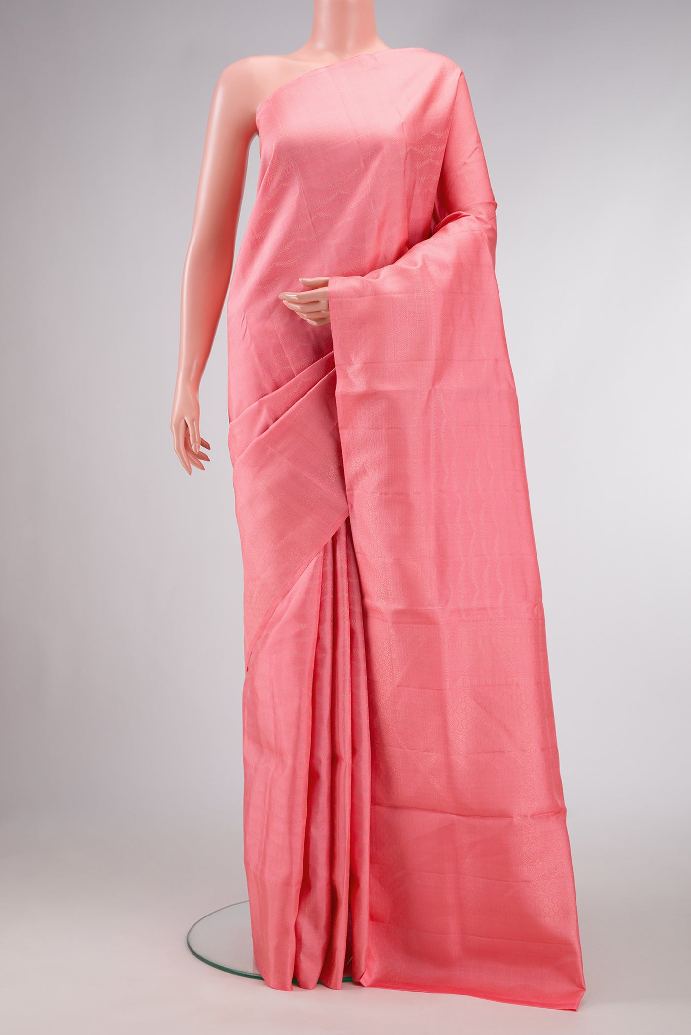 Peach Dual Tone Soft Silk Saree with Zari Brocade on the body and Fancy Border.  displayed on a mannequin