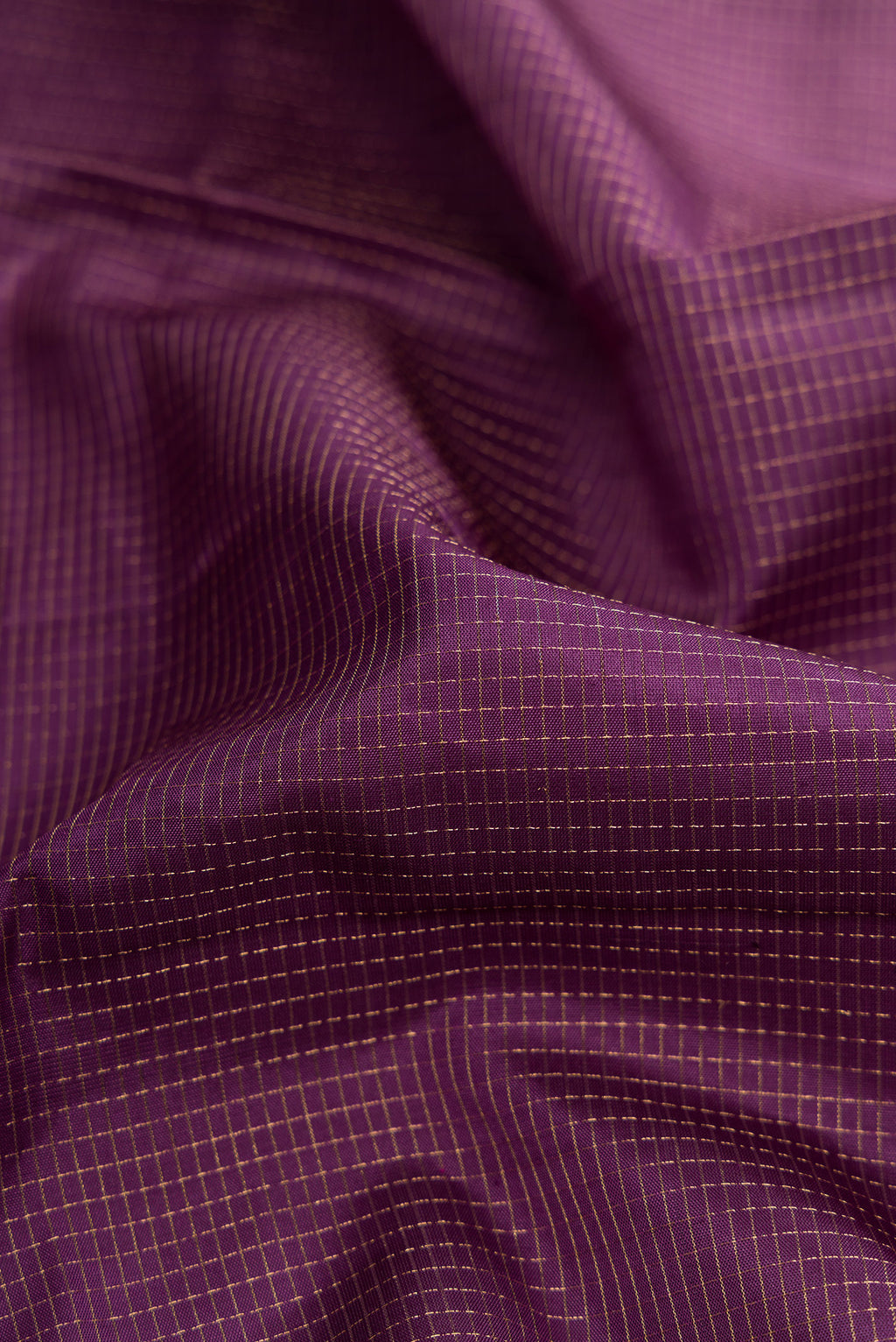 Close up of Purple Dual Tone Soft Silk Saree with Zari Brocade on the body and Fancy Border.  displaying folds