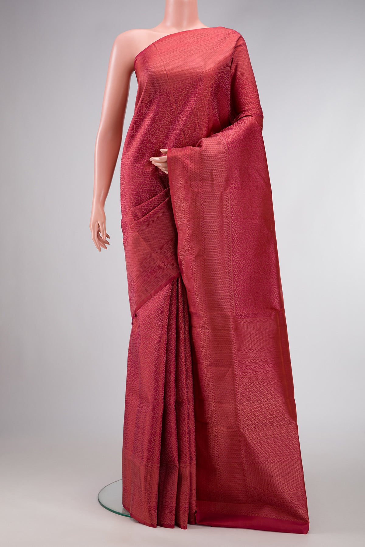 Brick Orange Dual Tone Soft Silk Saree with Zari Brocade on the body and Fancy Border.  displayed on a mannequin