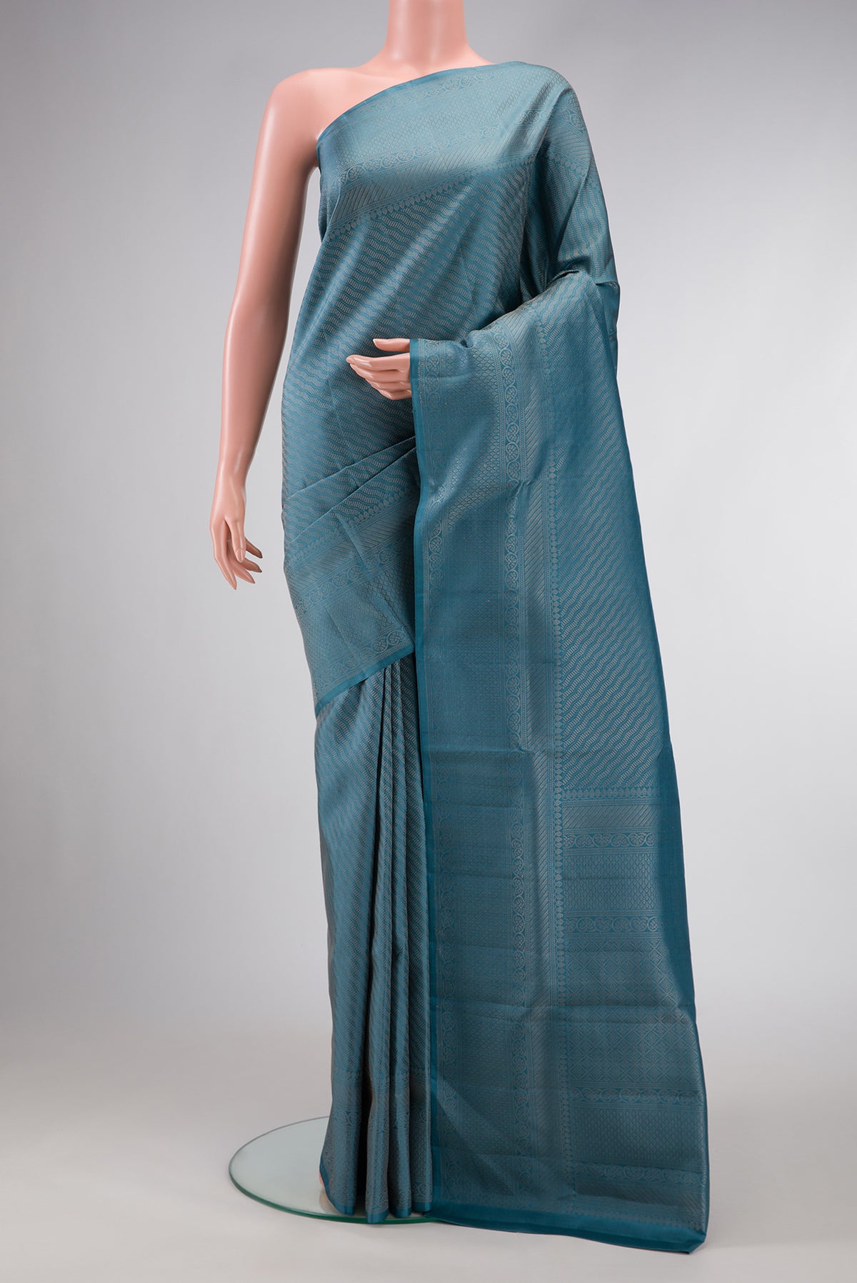 Maya Blue Dual Tone Soft Silk Saree with Zari Brocade on the body and Fancy Border.  displayed on a mannequin