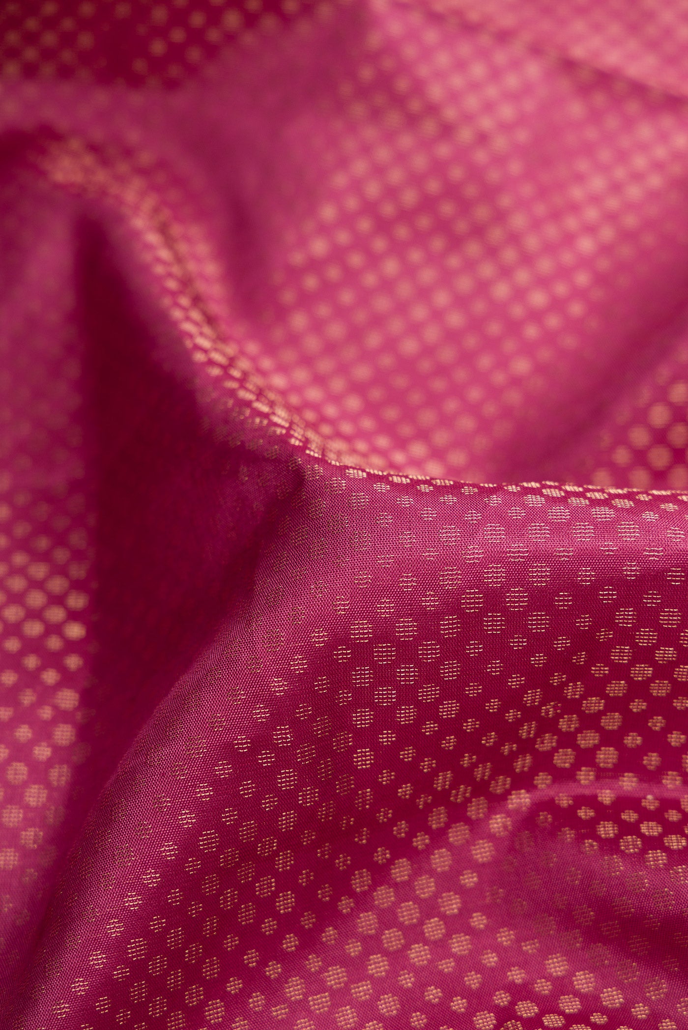 Close up of Pink Dual Tone Soft Silk Saree with Zari Brocade on the body and Fancy Border.  displaying folds