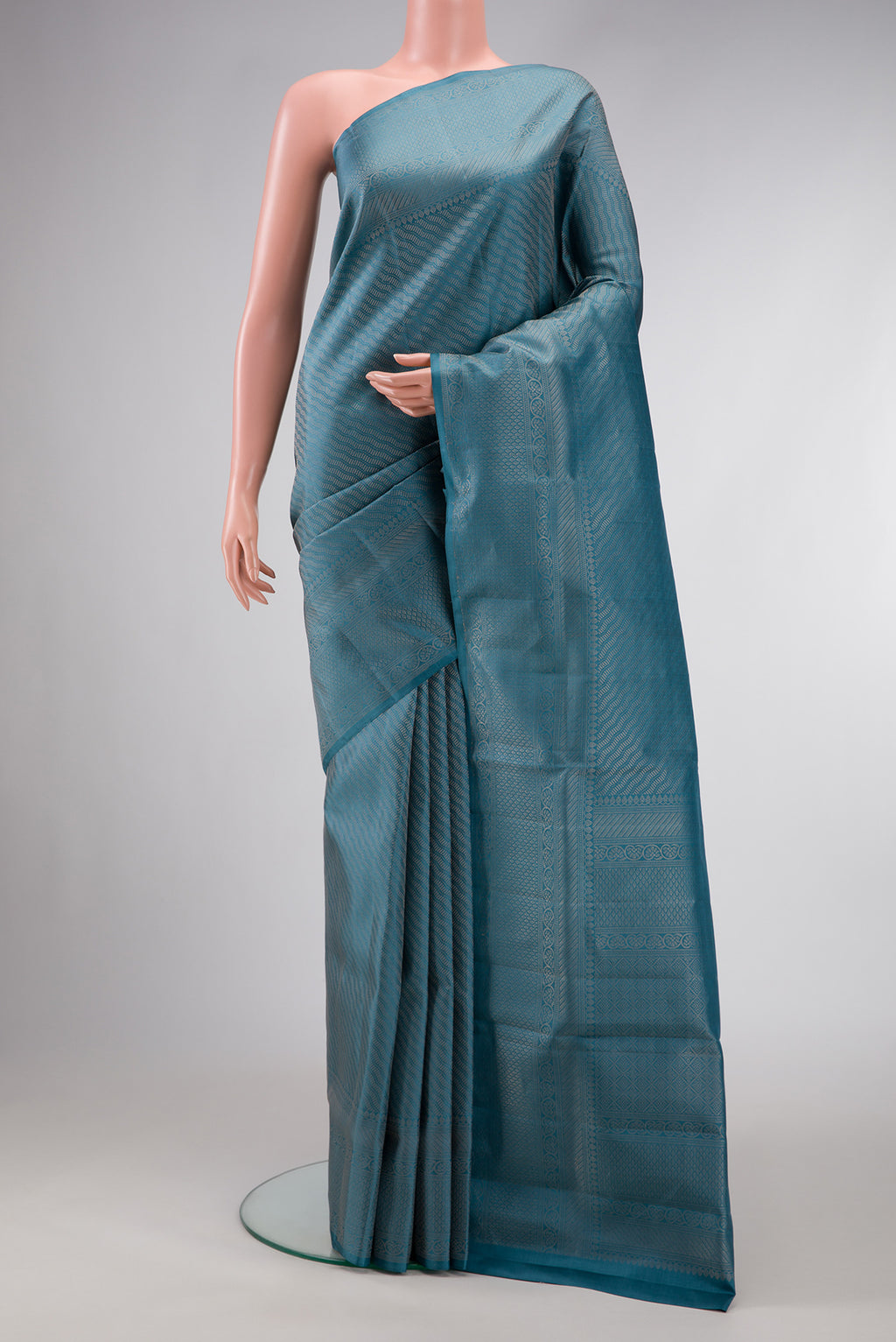 Maya Blue Dual Tone Soft Silk Saree with Zari Brocade on the body and Fancy Border.  displayed on a mannequin