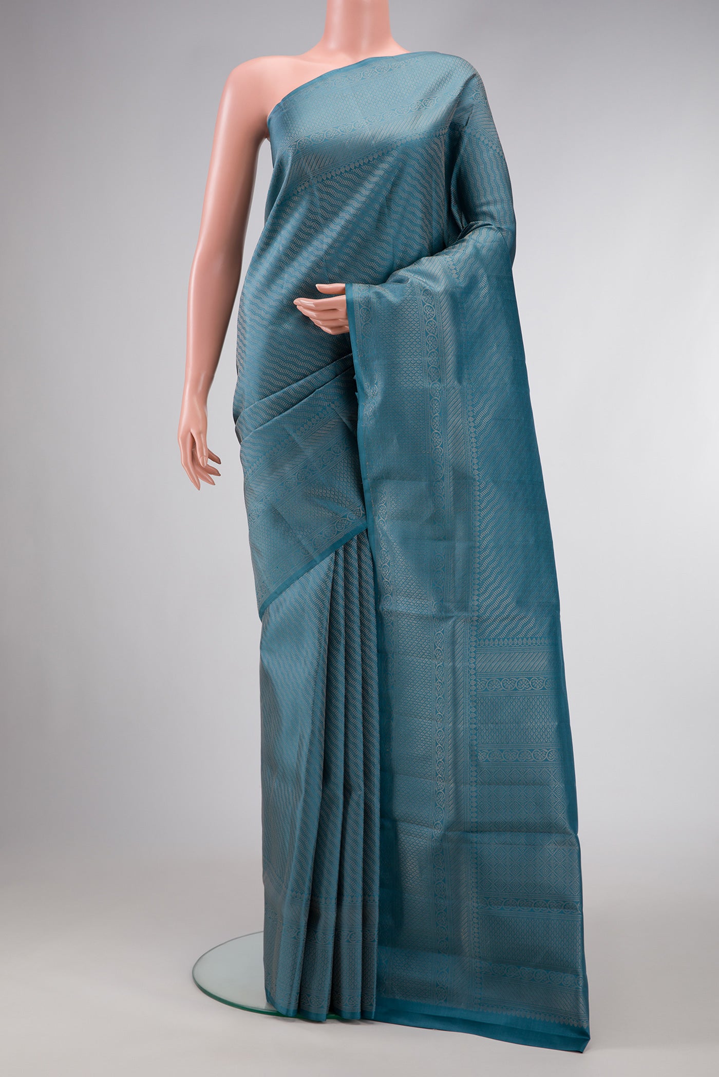 Maya Blue Dual Tone Soft Silk Saree with Zari Brocade on the body and Fancy Border.  displayed on a mannequin