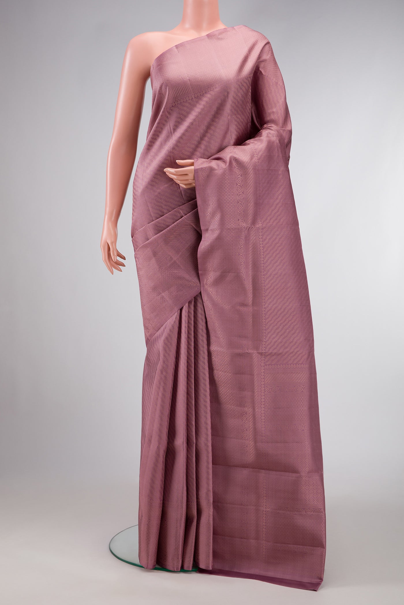 Rose Gold Dual Tone Soft Silk Saree with Zari Brocade on the body and Zari Border.  displayed on a mannequin