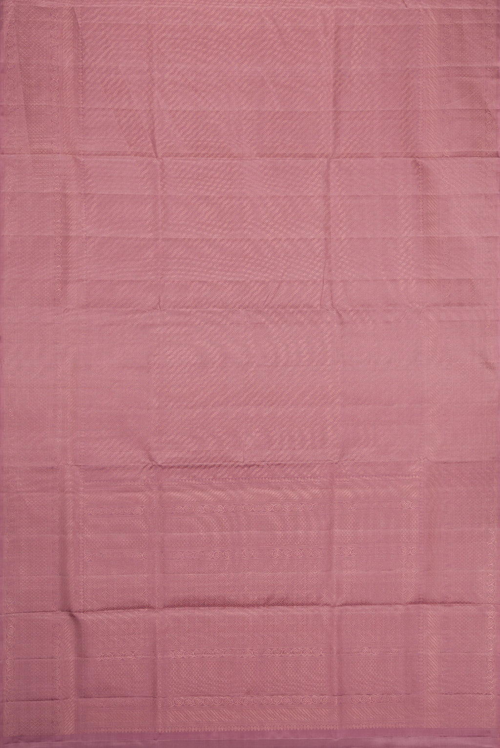 Flat view of Rose Gold Dual Tone Soft Silk Saree with Zari Brocade on the body and Zari Border. 