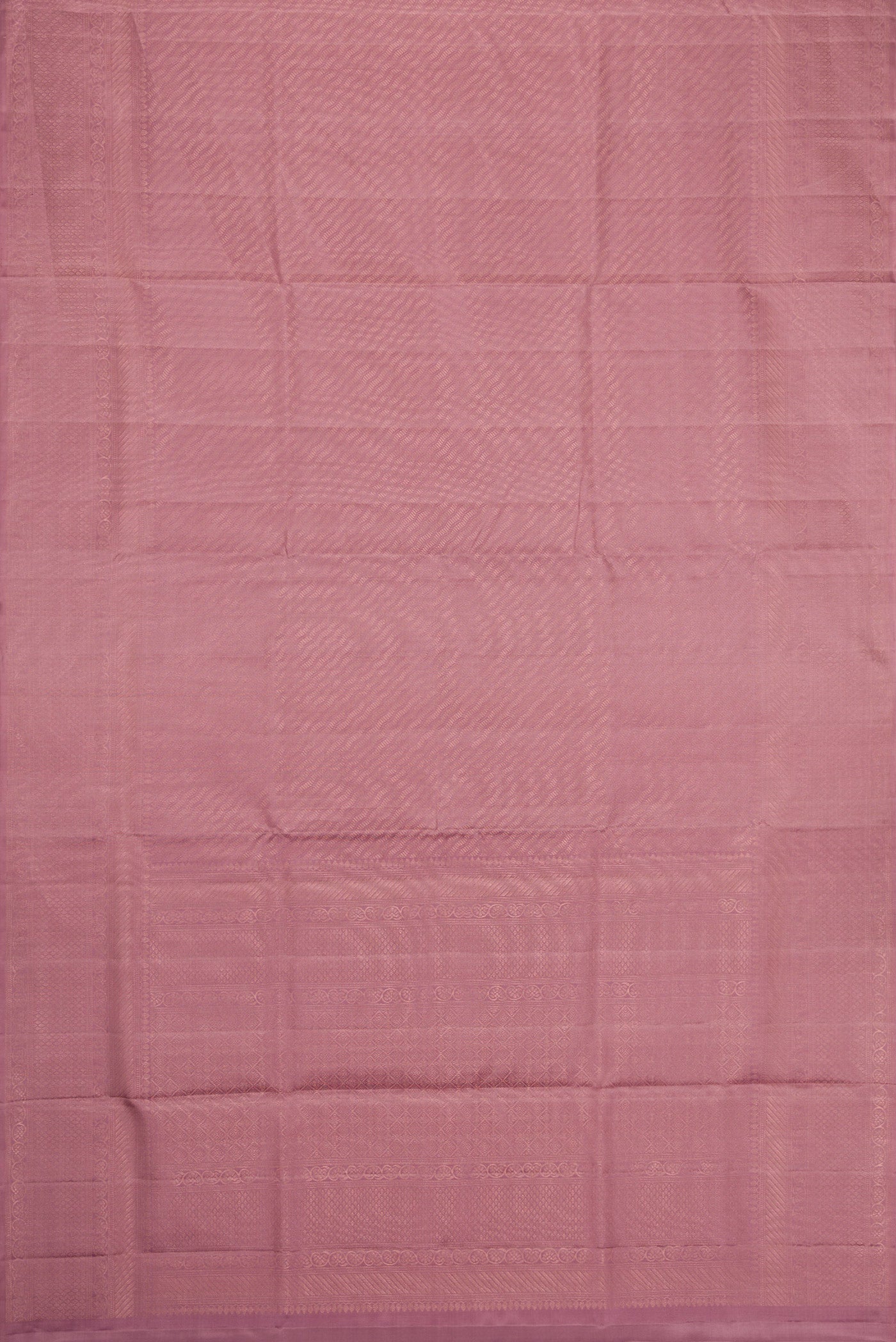 Flat view of Rose Gold Dual Tone Soft Silk Saree with Zari Brocade on the body and Zari Border. 