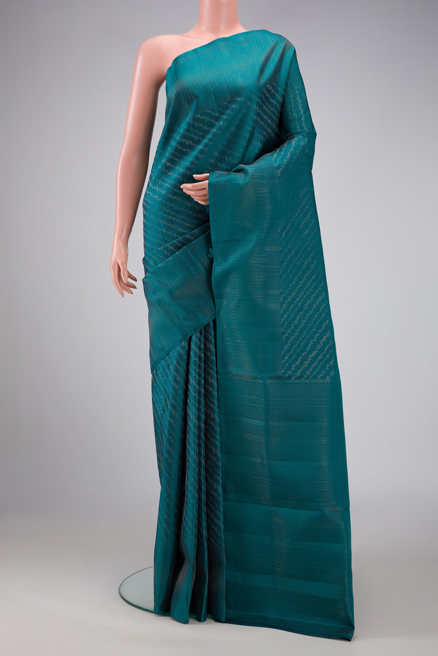 Peacock Blue Dual Tone Soft Silk Saree with Zari Brocade on the body and Zari Border.  displayed on a mannequin