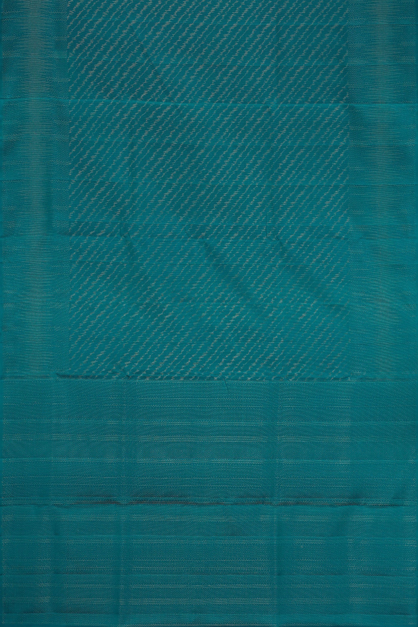 Flat view of Peacock Blue Dual Tone Soft Silk Saree with Zari Brocade on the body and Zari Border. 