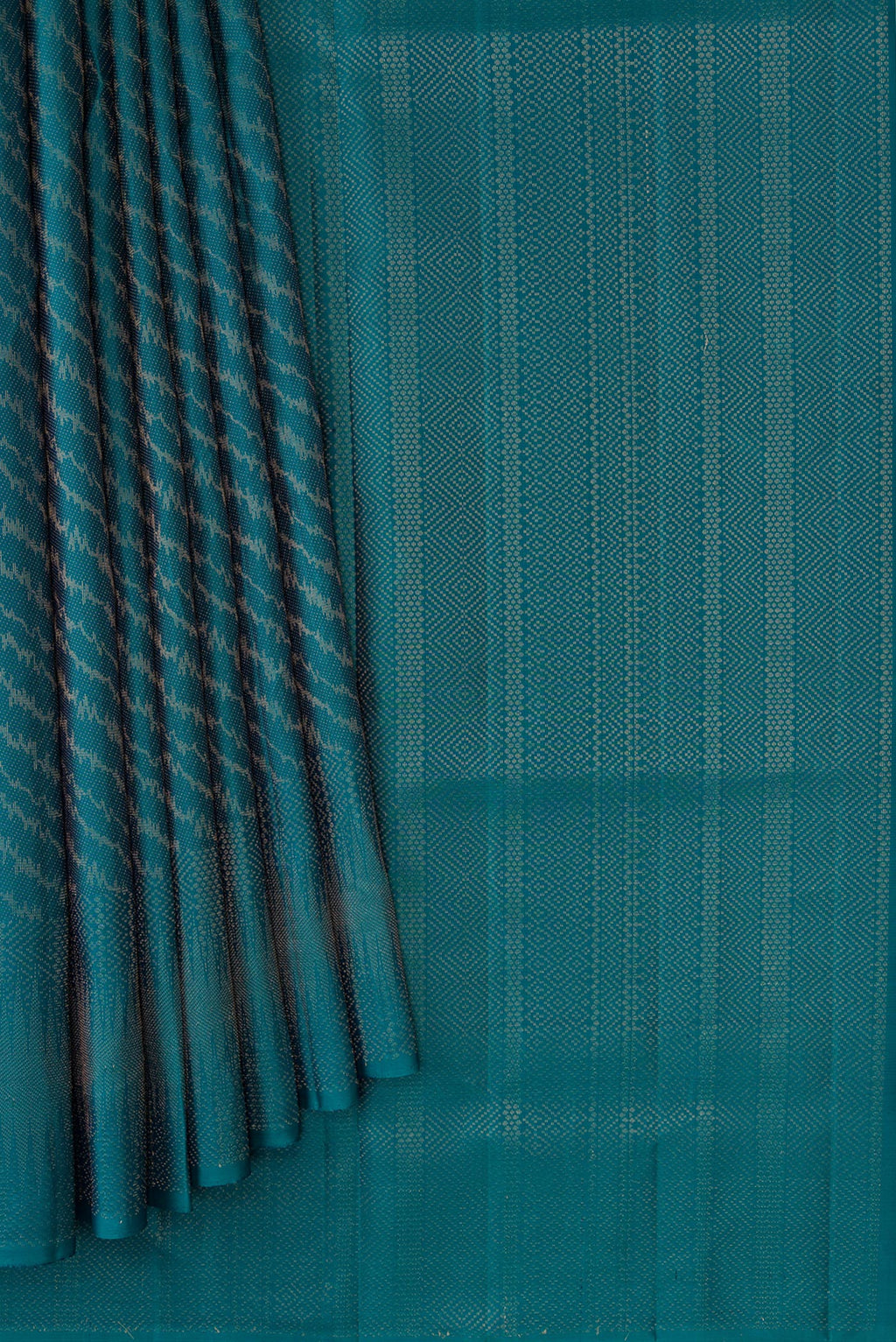 Pleats and pallu of Peacock Blue Dual Tone Soft Silk Saree with Zari Brocade on the body and Zari Border. 