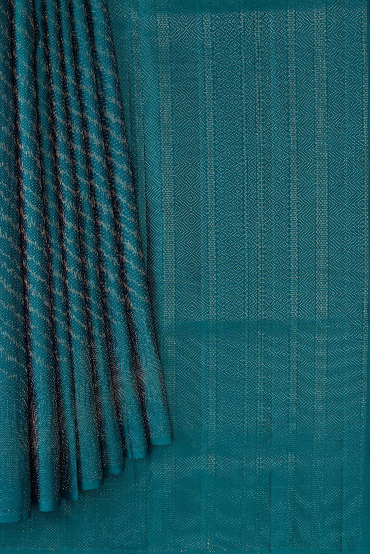 Pleats and pallu of Peacock Blue Dual Tone Soft Silk Saree with Zari Brocade on the body and Zari Border. 