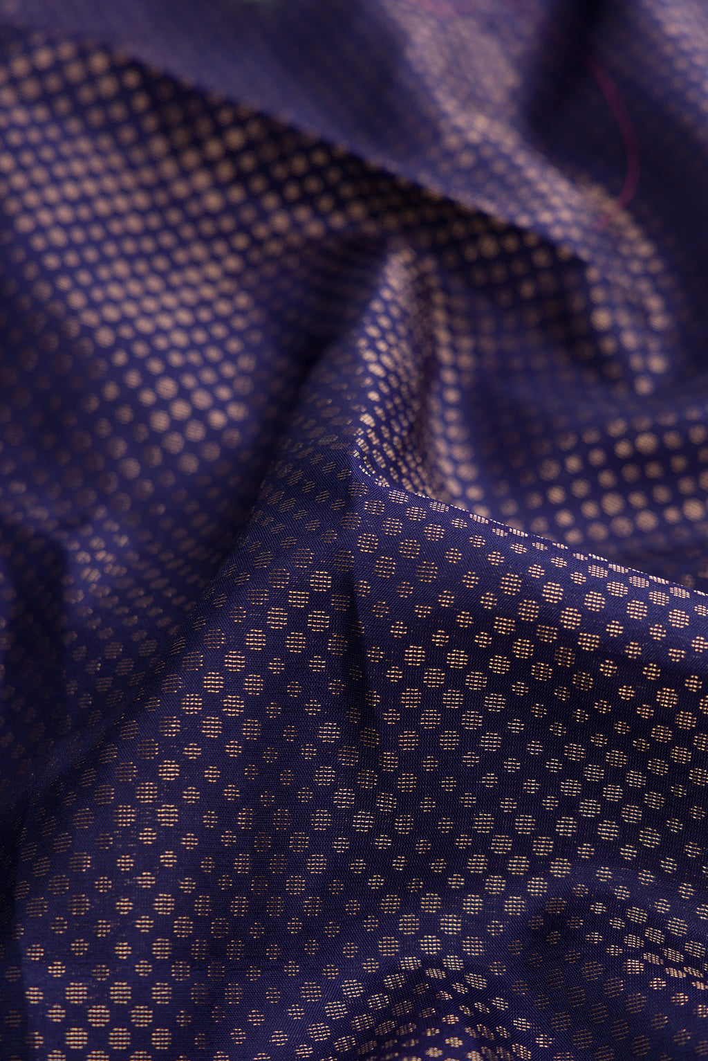 Close up of Navy Blue Dual Tone Soft Silk Saree with Zari Brocade on the body and Fancy Border.  displaying folds