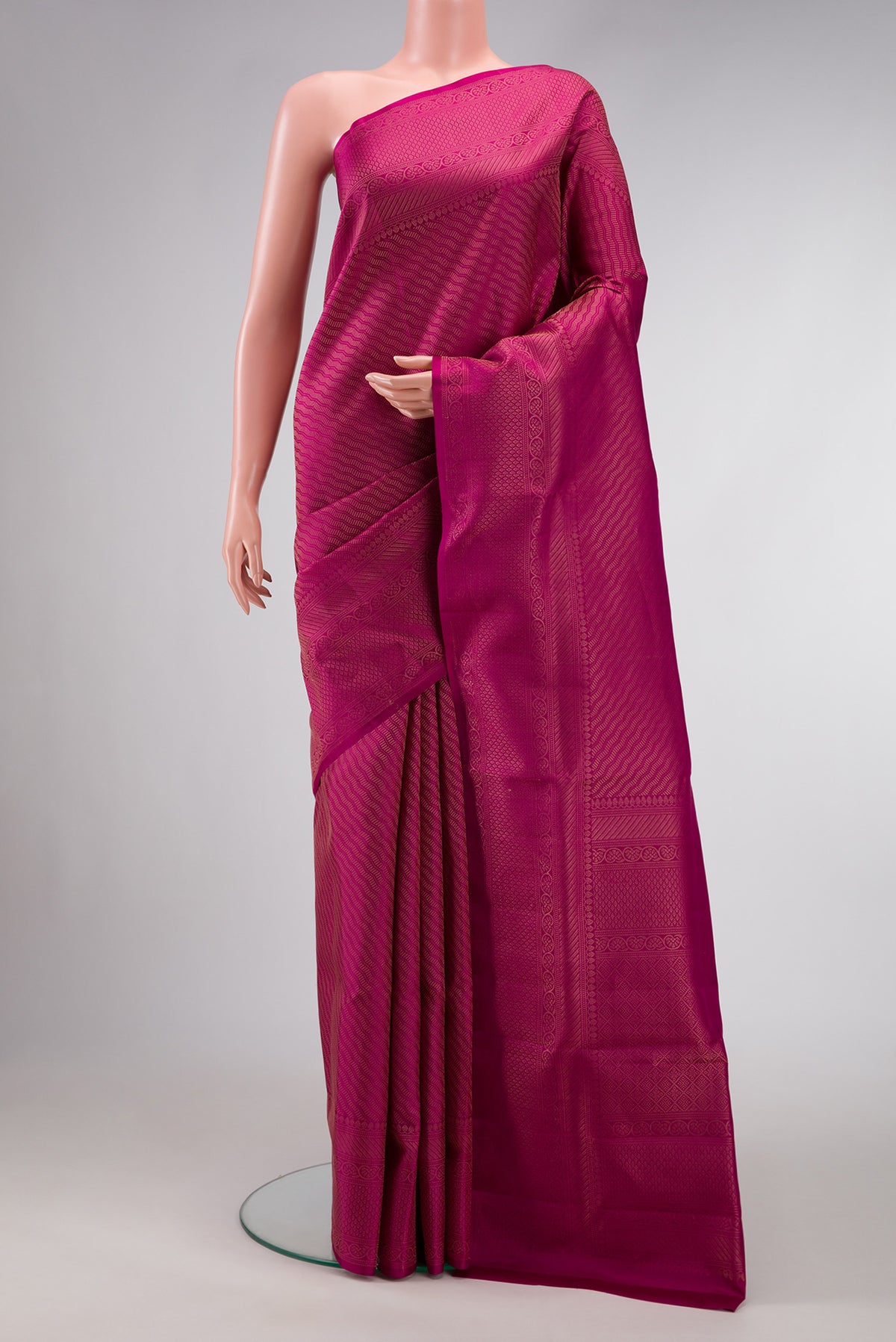 Magenta Dual Tone Soft Silk Saree with Zari Brocade on the body and Fancy Border.  displayed on a mannequin