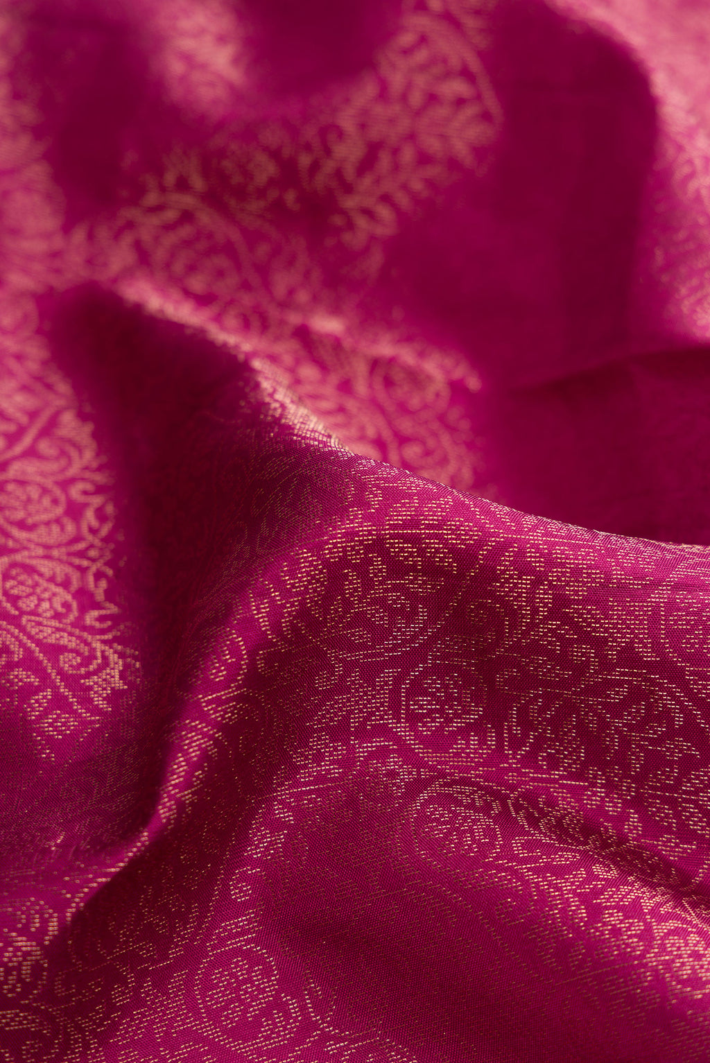 Close up of Dark Pink Dual Tone Soft Silk Saree with Zari Brocade on the body and Fancy Border.  displaying folds