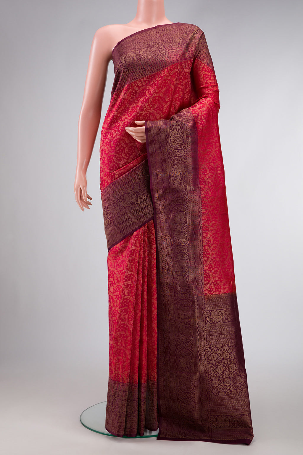 Brick Orange Dual Tone Soft Silk Saree with Zari Brocade on the body and Fancy Border.  displayed on a mannequin