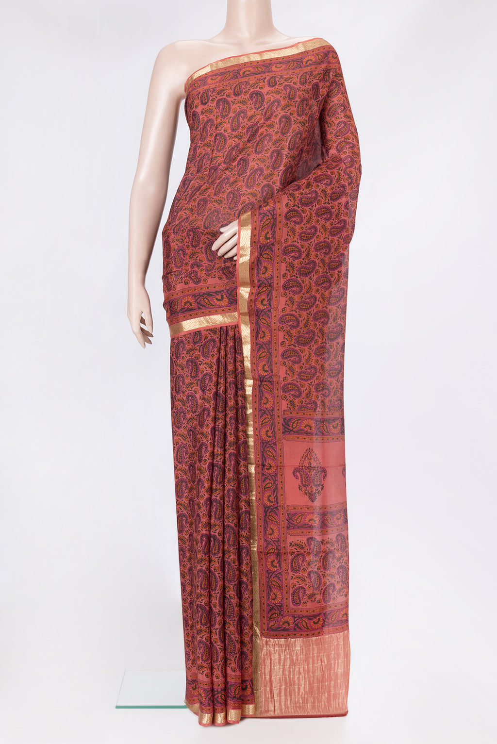 Golden Peach Dual Tone Crepe Saree with Printed design on the body and Zari Border.  displayed on a mannequin