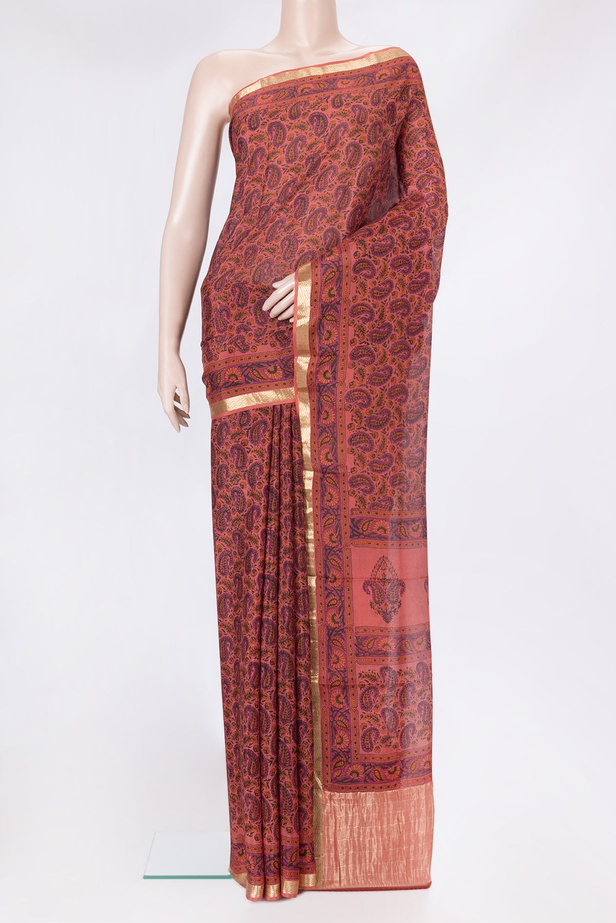Golden Peach Dual Tone Crepe Saree with Printed design on the body and Zari Border.  displayed on a mannequin