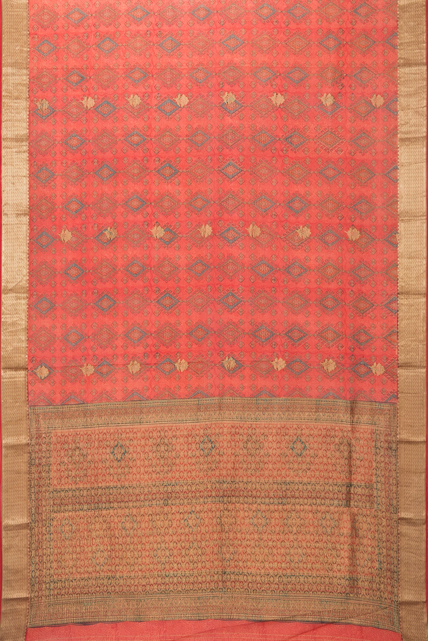 Flat view of Orange Crepe Saree with Printed design on the body and Zari Border. 