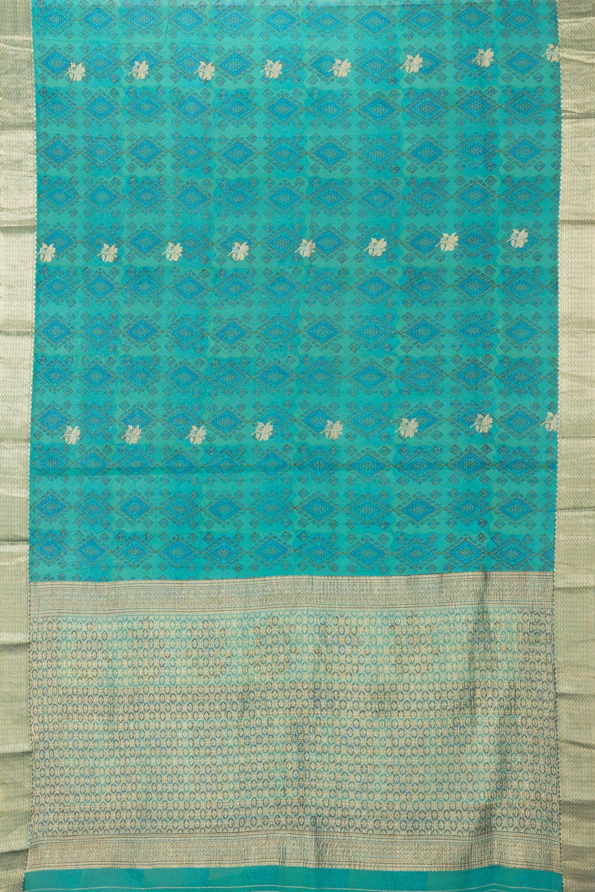 Flat view of Peacock Blue Dual Tone Crepe Saree with Printed design on the body and Zari Border. 