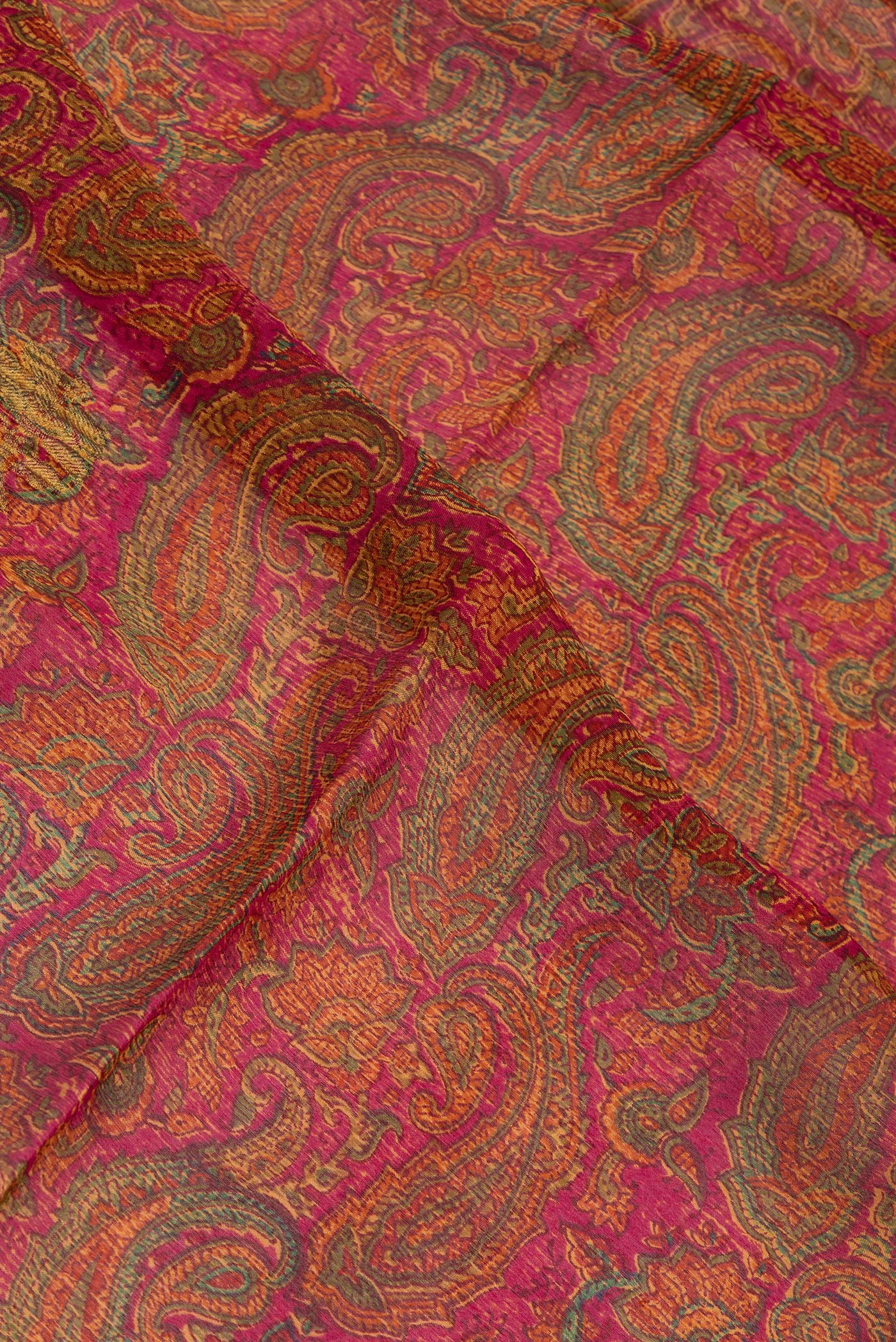 Close up of Dark Pink Mysore Chiffon Saree with Printed design on the body and Zari Border.  displaying folds