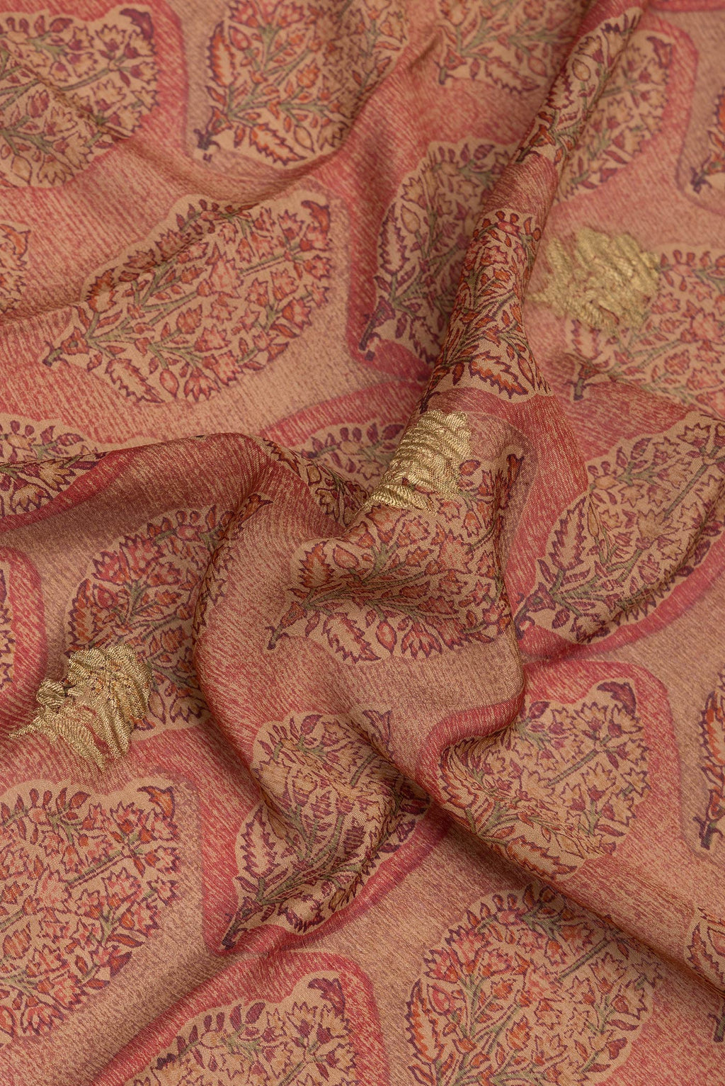 Close up of Brown Crepe Saree with Printed design on the body and Zari Border.  displaying folds