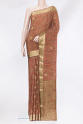 Brown Crepe Saree with Printed design on the body and Zari Border.  displayed on a mannequin