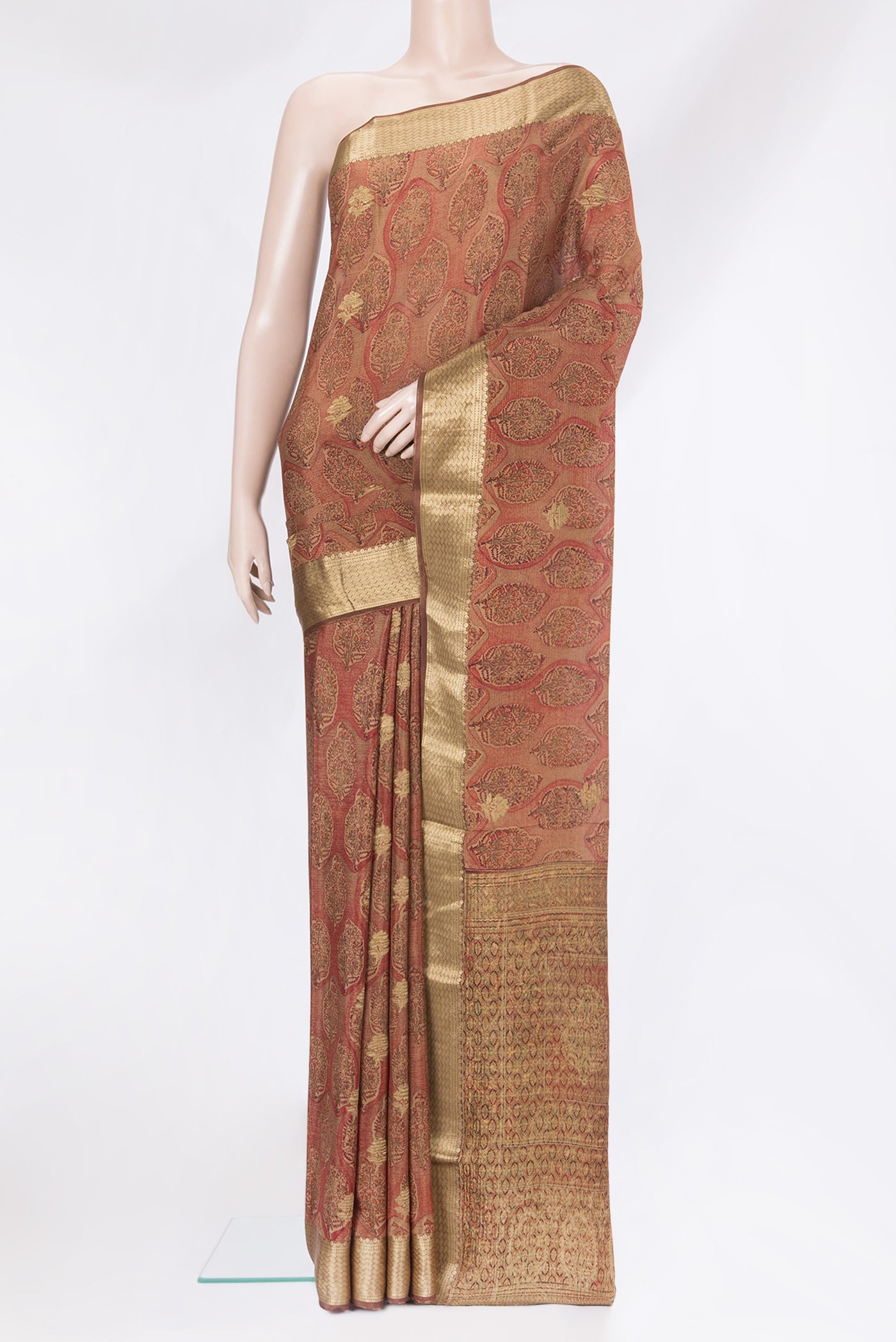 Brown Crepe Saree with Printed design on the body and Zari Border.  displayed on a mannequin